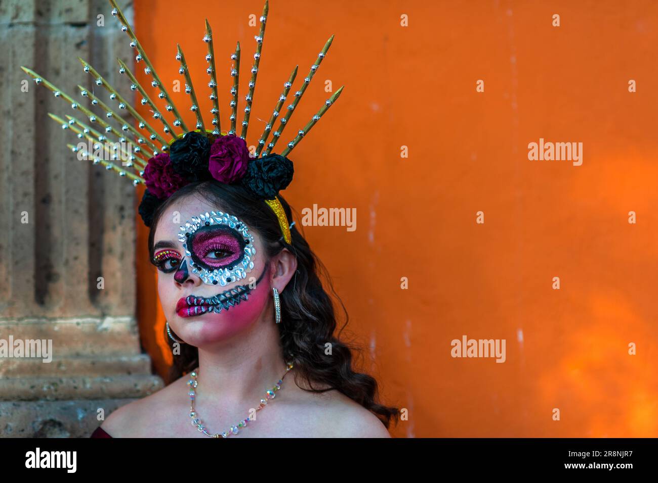 A young Mexican woman, dressed as La Catrina, takes part in the Day of the Dead festivities in Morelia, Mexico. Stock Photo