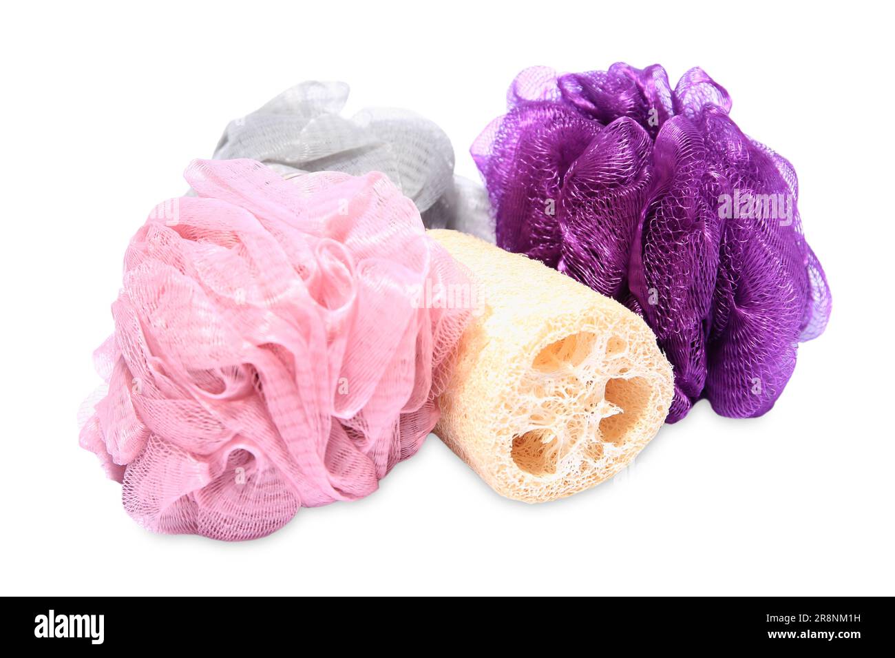 New shower puffs and loofah sponge on white background. Personal