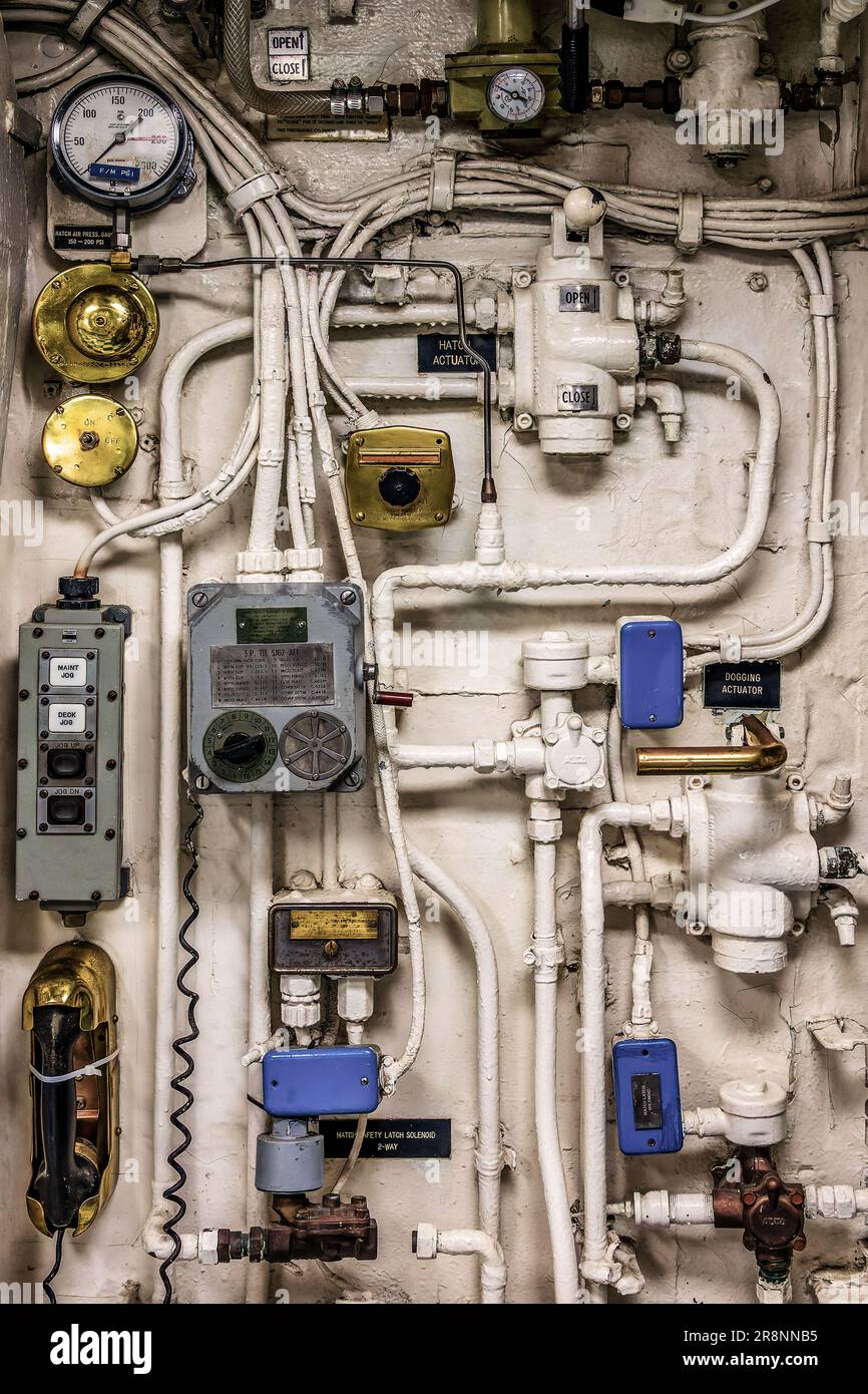 Complex machinery, steampunk pipes, valves and controls on USS Midway, San Diedo Stock Photo