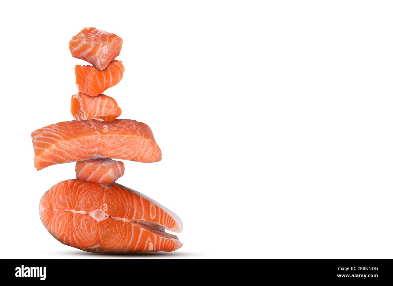 Cut fresh salmon falling on white background Stock Photo - Alamy