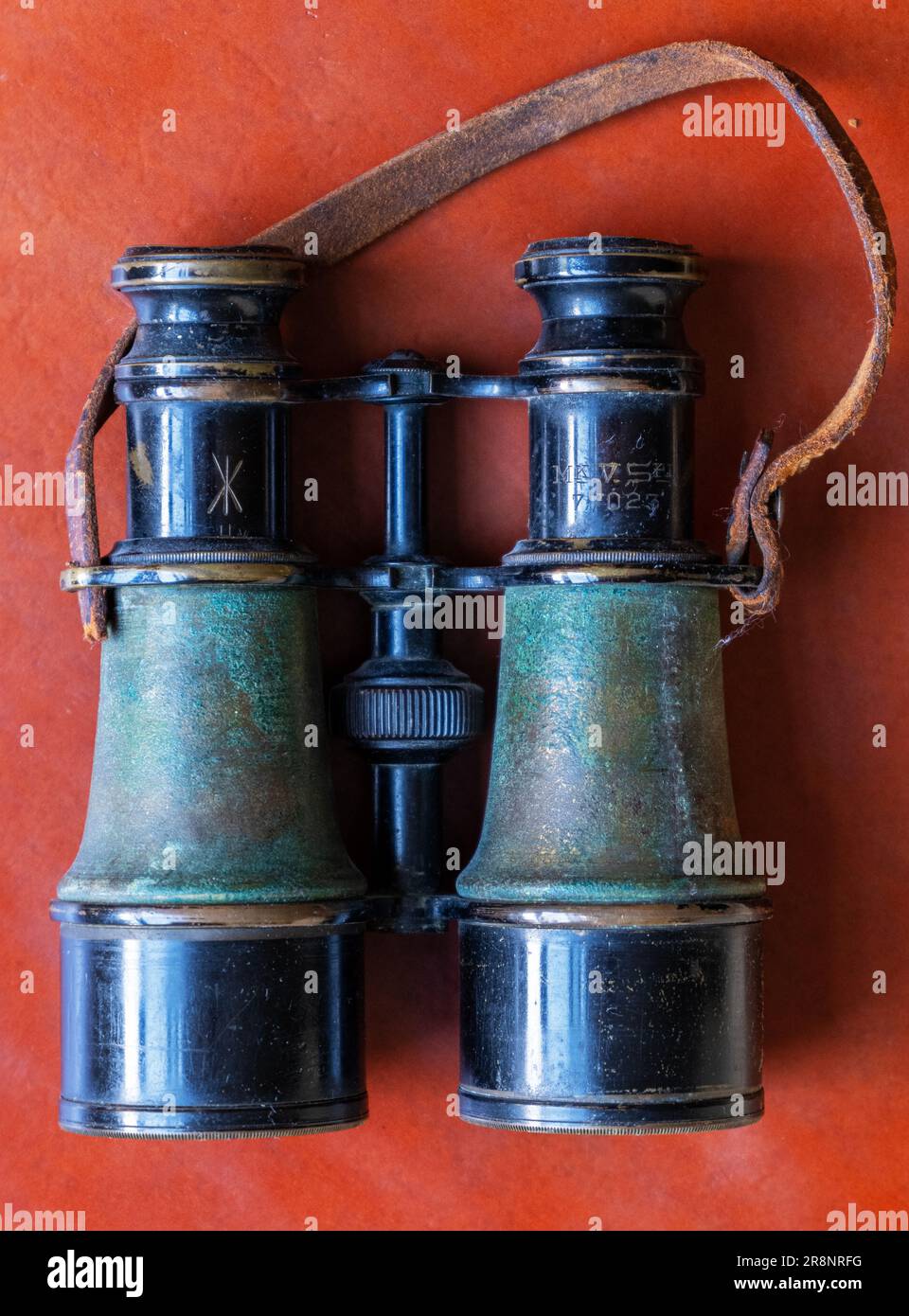 Pair of World War II binoculars, leather strap, green livery, very worn and wellused Stock