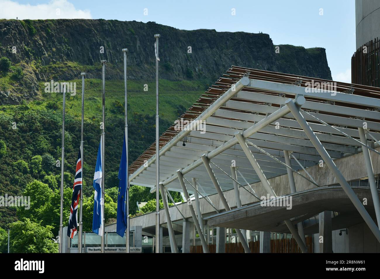 Edinburgh Scotland, UK 22 June 2023. Flags fly at half-mast at the Scottish Parliament following the death of SNP politician Winnie Ewing. credit sst/alamy live news Stock Photo