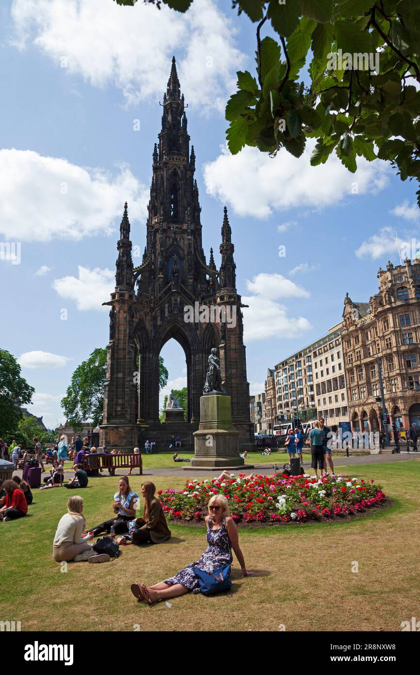 Edinburgh, city centre Scotland, UK. 22nd June 2023. Hot afternoon with temperature of 20 degrees centigrade for those visiting the landmark areas in the Scottish capital. Pictured: People relax in Princes Street Gardens East with Scott Monument in background. Credit: Arch White/alamy live news. Stock Photo