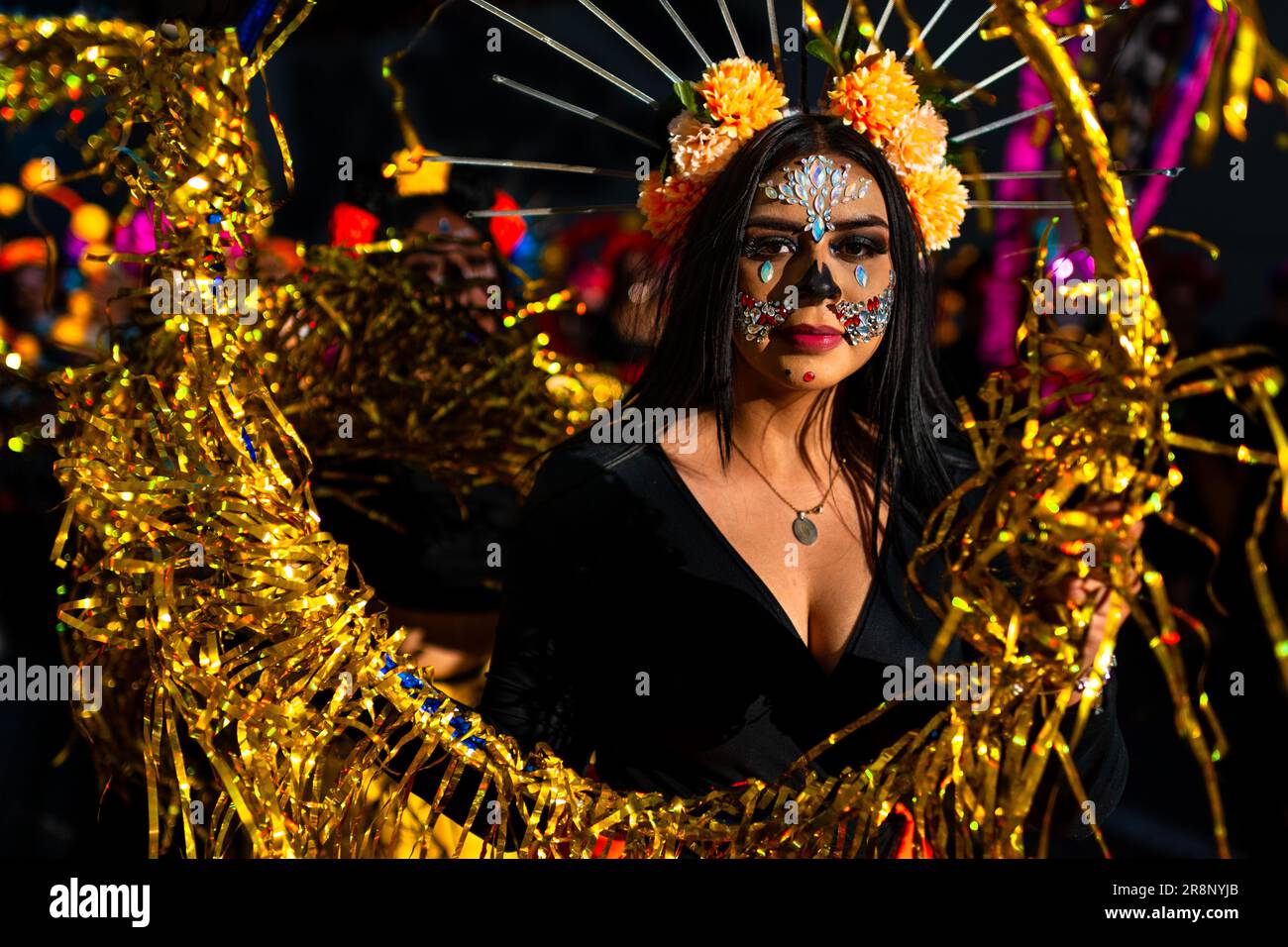 A young Mexican woman, wearing La Catrina face paint, performs a dance act during the Day of the Dead festivities in Guadalajara, Jalisco, Mexico. Stock Photo