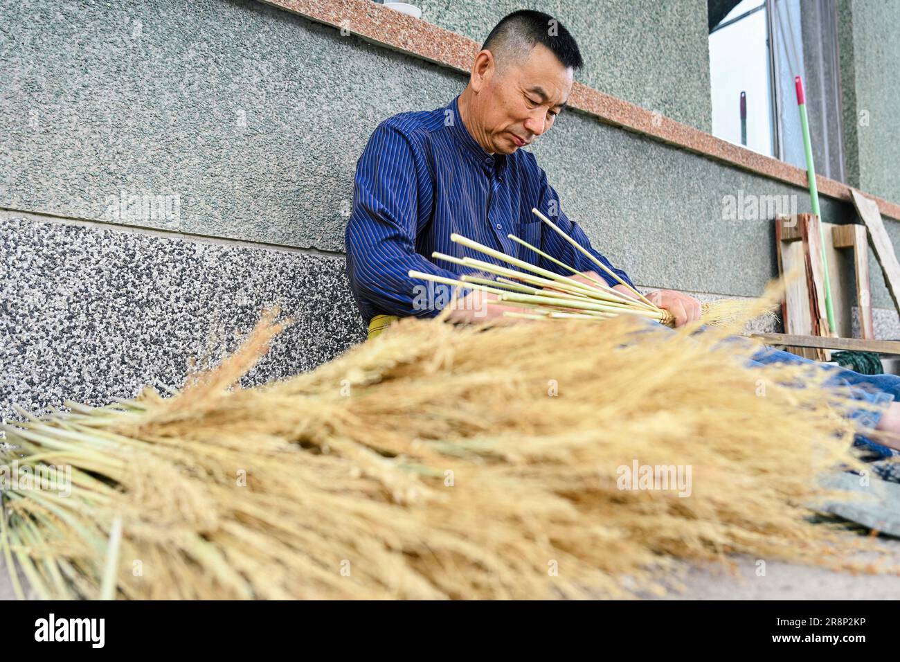 CHANGCHUN, June 22, 2023 (Xinhua) Rong Fengming makes broom