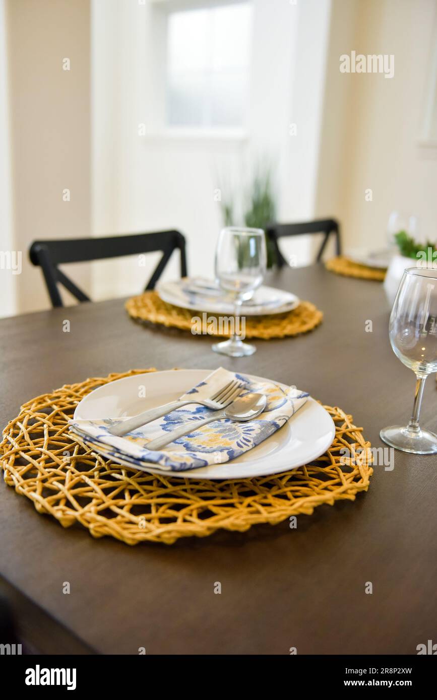 A collection of dinnerware artfully arranged on a table Stock Photo