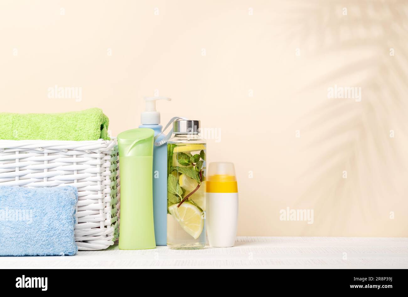 White rolled up spa towels with body care products Stock Photo - Alamy