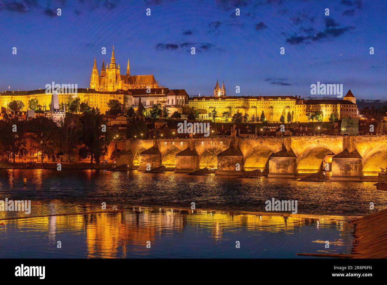 PRAGUE, CZECH REPUBLIC, EUROPE - Prague skyline at night with Charles Bridge, Prague Castle and St. Vitus Cathedral and Castle District, Hradcany, on Stock Photo