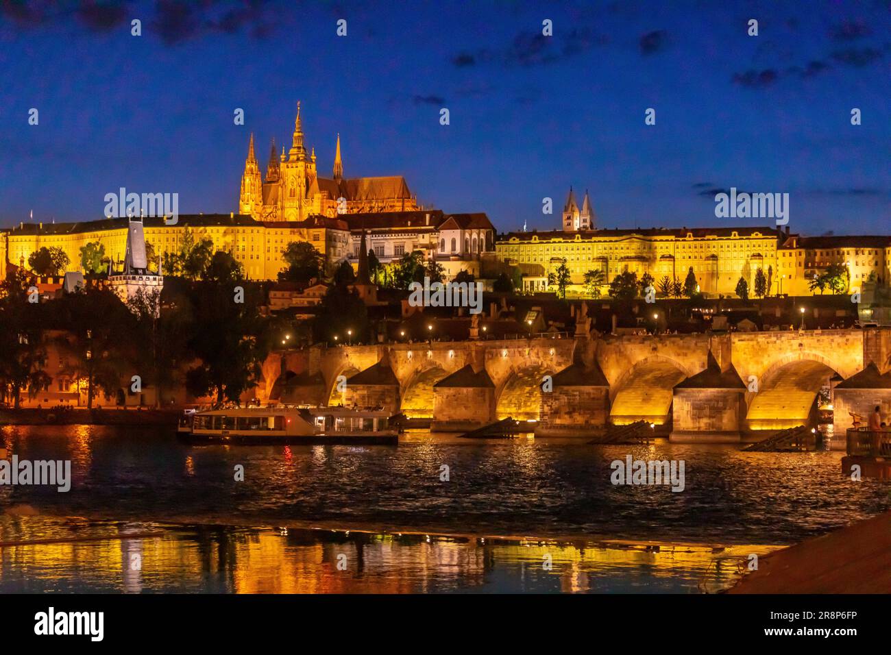 PRAGUE, CZECH REPUBLIC, EUROPE - Prague skyline at night with Charles Bridge, Prague Castle and St. Vitus Cathedral and Castle District, Hradcany, on Stock Photo