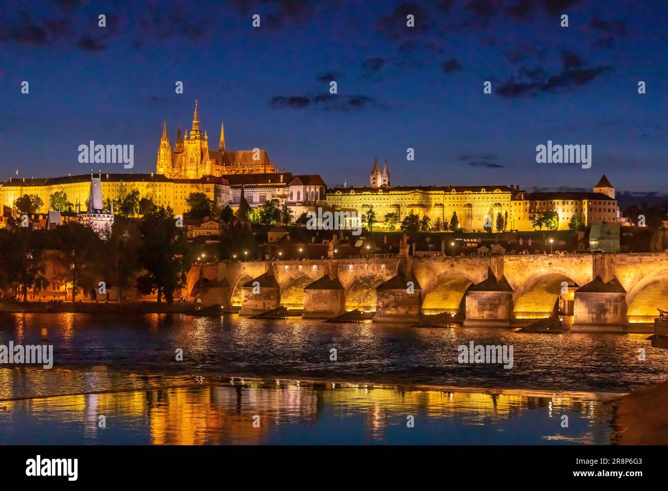 PRAGUE, CZECH REPUBLIC, EUROPE - Prague skyline at night with Charles Bridge, Prague Castle and St. Vitus Cathedral and Castle District, Hradcany, on Stock Photo