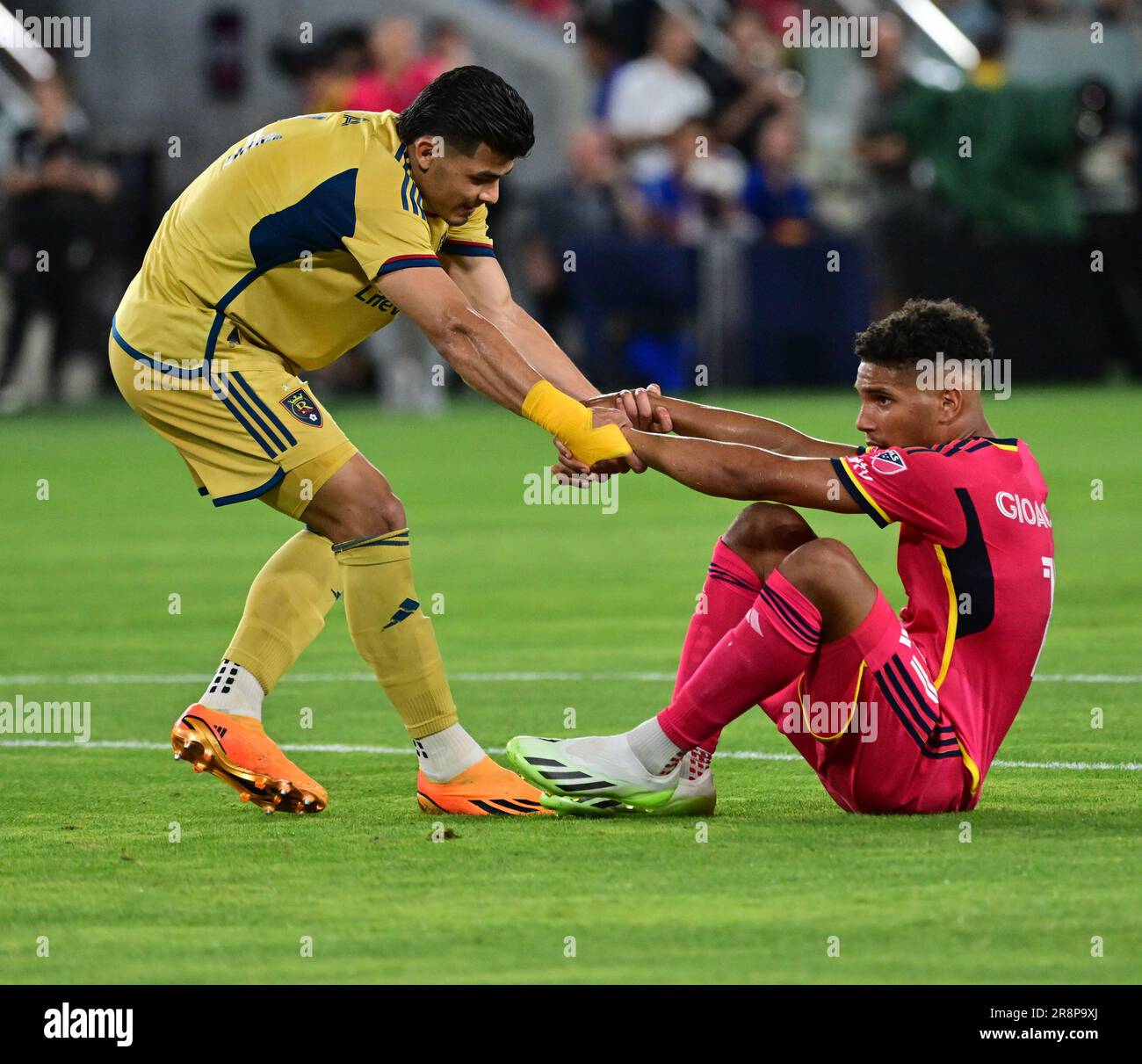Real Salt Lake defender Brayan Vera (4) helps up St. Louis City forward