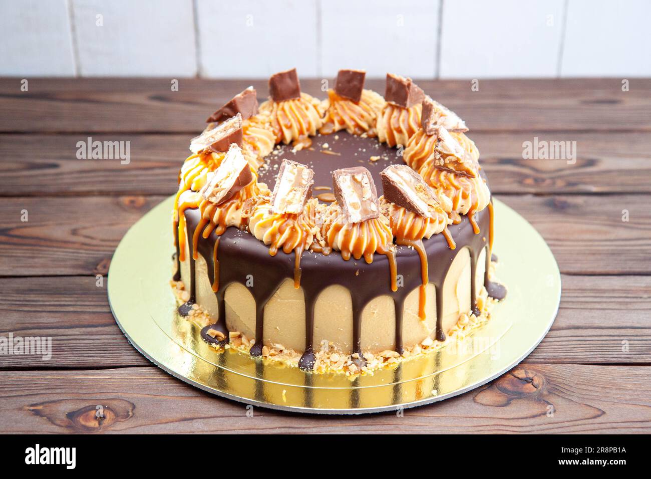 Gorgeous snickers cake with peanut butter cream, melted chocolate ...