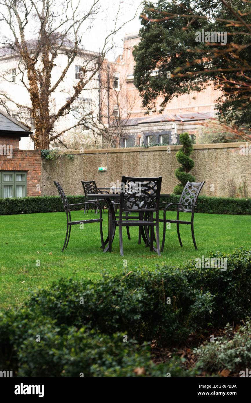 A vibrant outdoor dining setup consisting of a small round table and