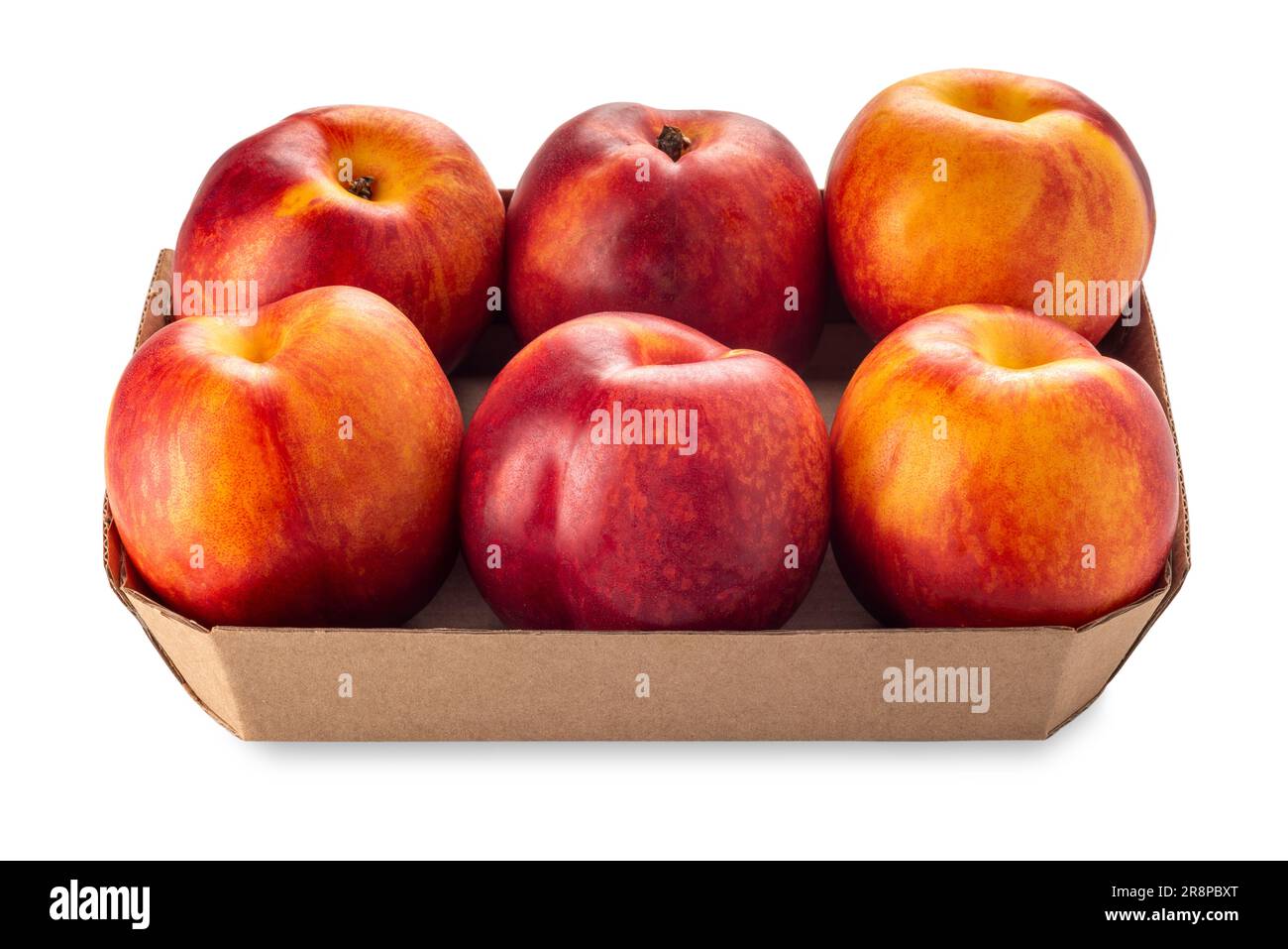 Six nectarine peaches in cardboard tray for sale in market isolated on