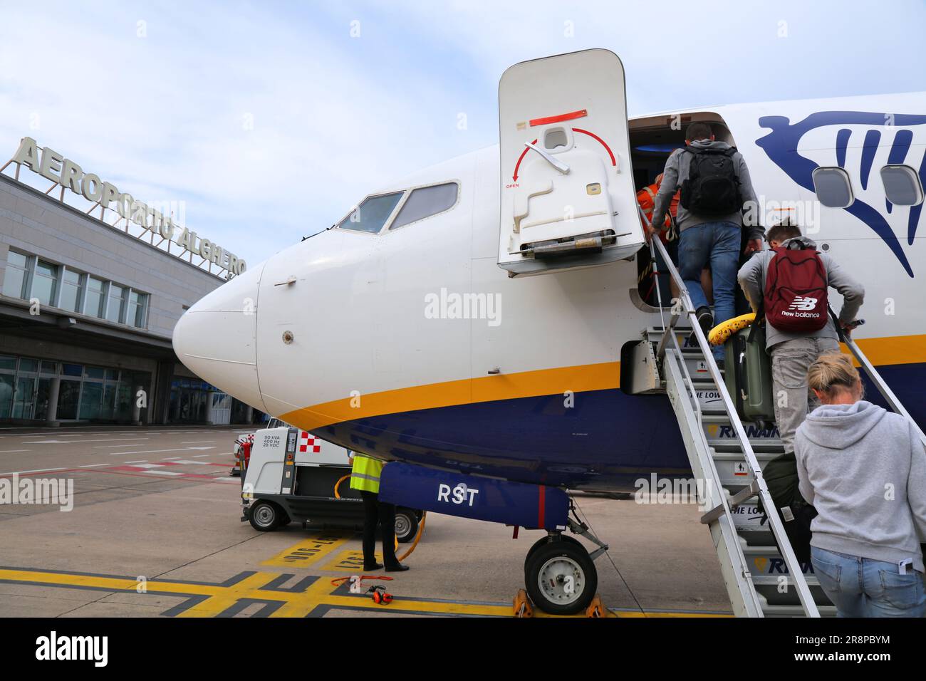 ALGHERO ITALY MAY 30 2023 Passengers board Boeing 737 800 airplane of low cost airline Ryanair by stairs from airport tarmac Stock Photo Alamy