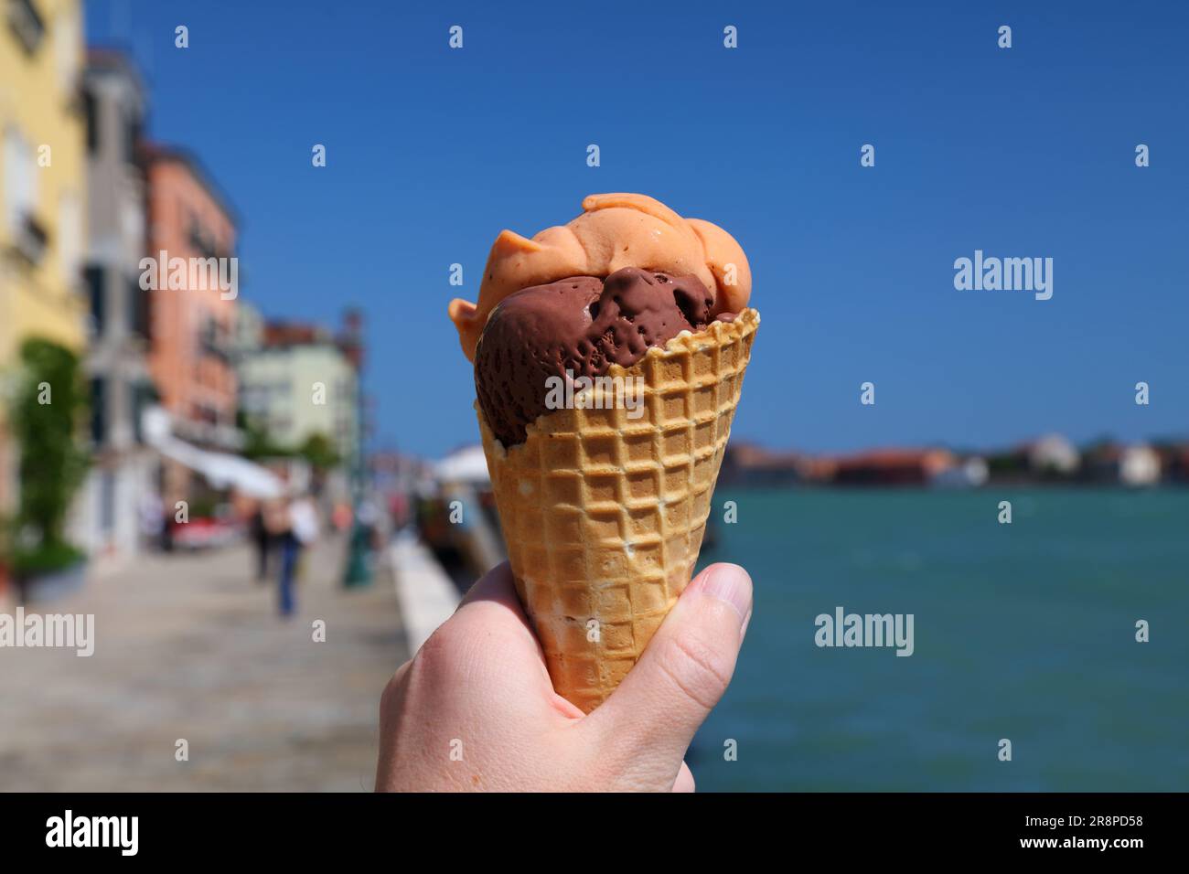 Ice cream in Venice, Italy. Hand holding Italian gelato ice cream in