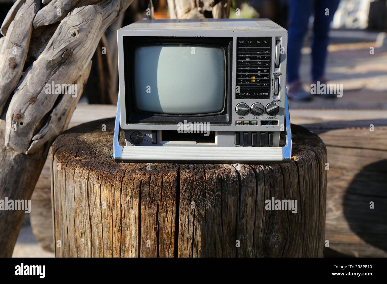 Vintage portable mini TV and radio. 1980s technology nostalgia small TV set. Stock Photo