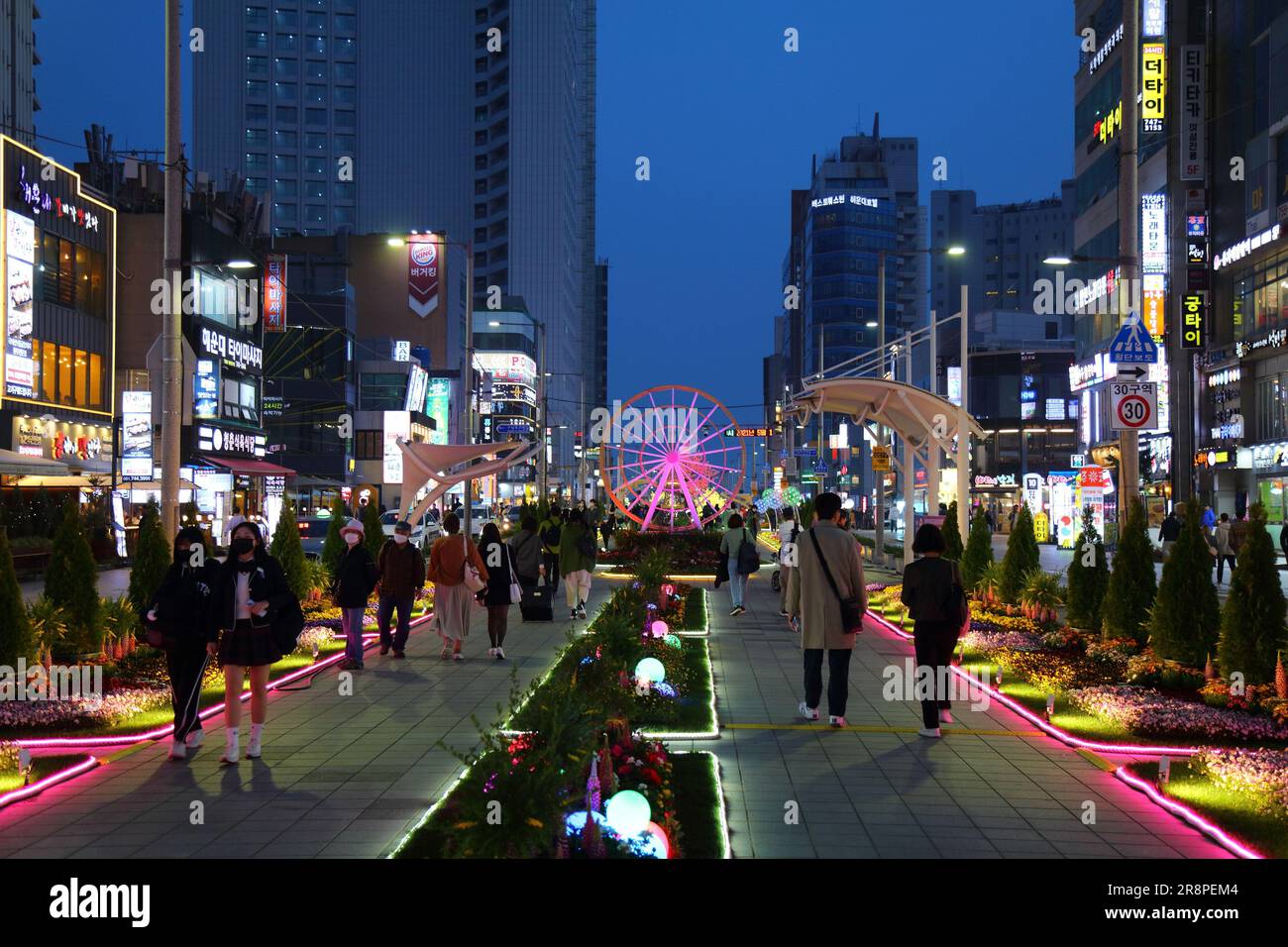 BUSAN, SOUTH KOREA - MARCH 29, 2023: People visit evening Haeundae district in Busan, South Korea. Stock Photo