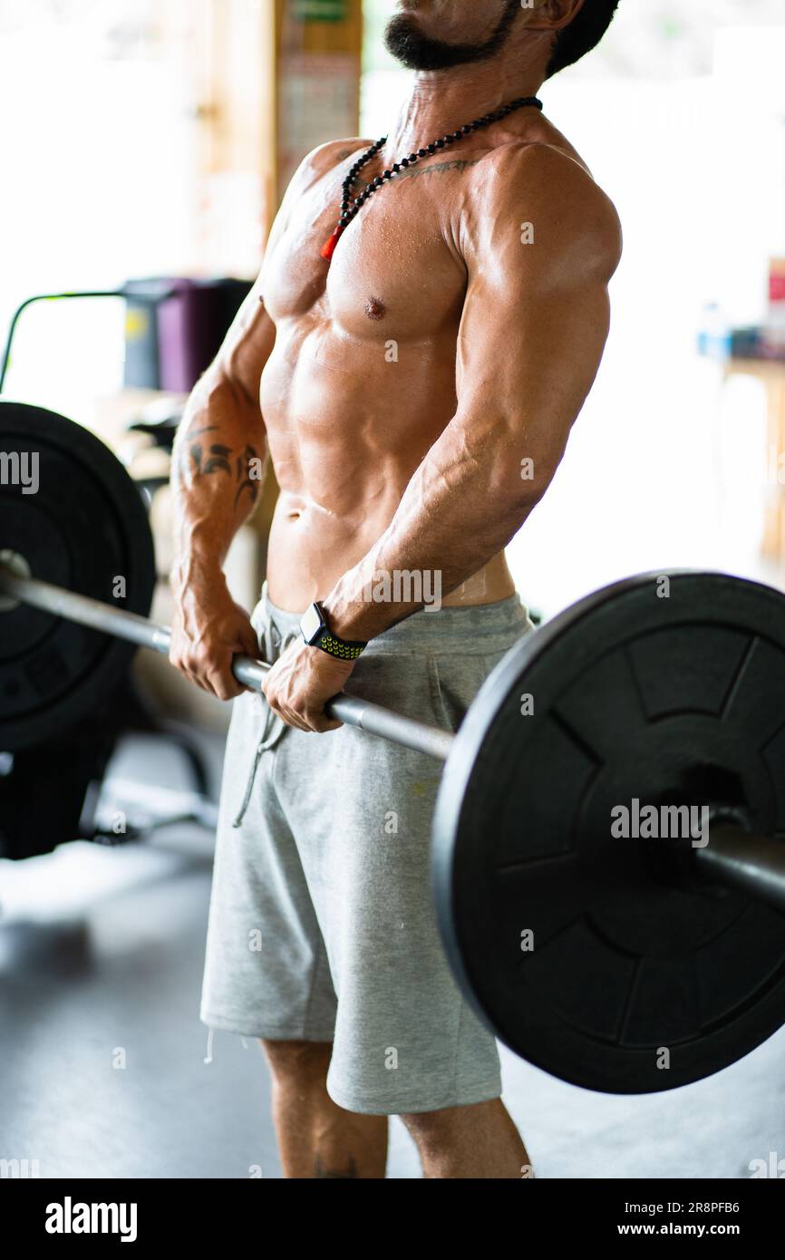 Photo with copy space of a man doing dead lift exercise Stock Photo