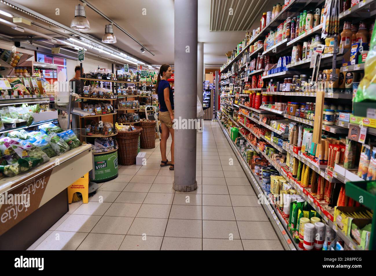 VIENNA, AUSTRIA - AUGUST 4, 2022: People visit Spar grocery store in Austria. Spar is a large supermarket chain originating from the Netherlands. Stock Photo