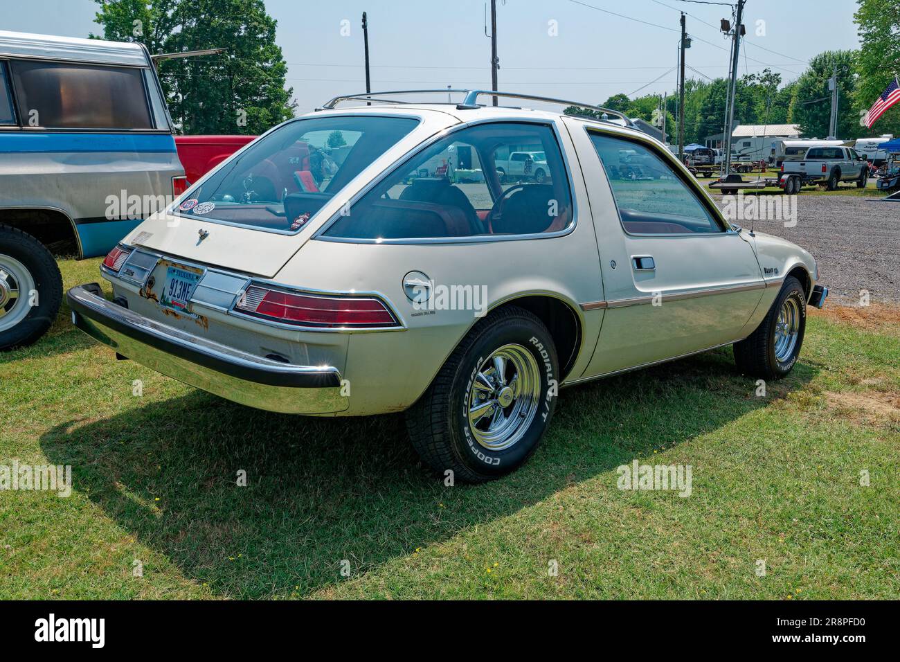 Backside angle view closeup of a restored late 1970s model AMC Pacer automobile back to original condition with some modifications parked outdoors Stock Photo