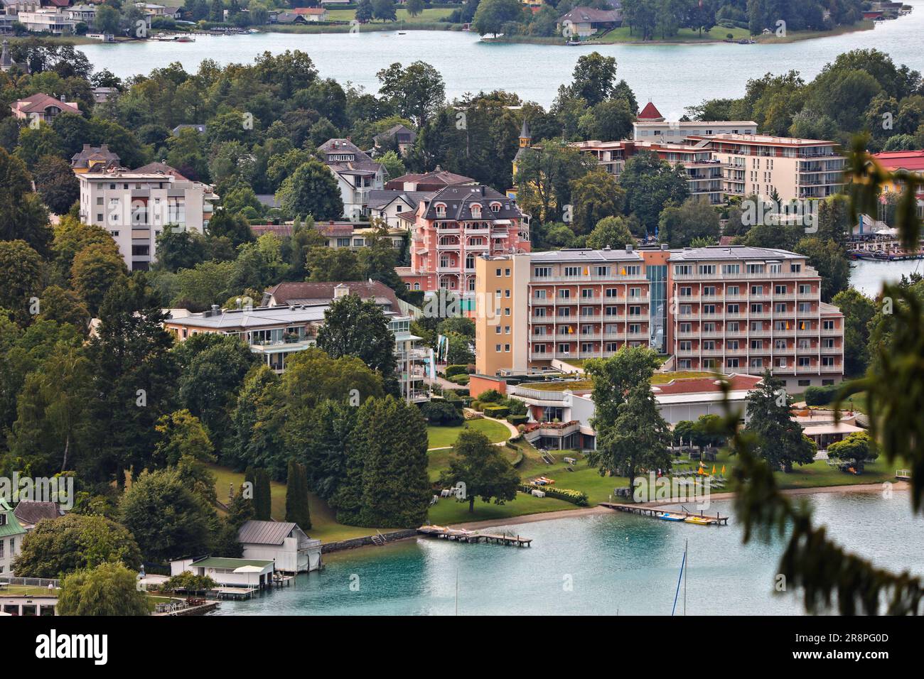 Worthersee mountain lake in Austrian Alps. Austria landscape in State of Carinthia. Hotels in Town of Portschach am Worther See (Poertschach). Stock Photo