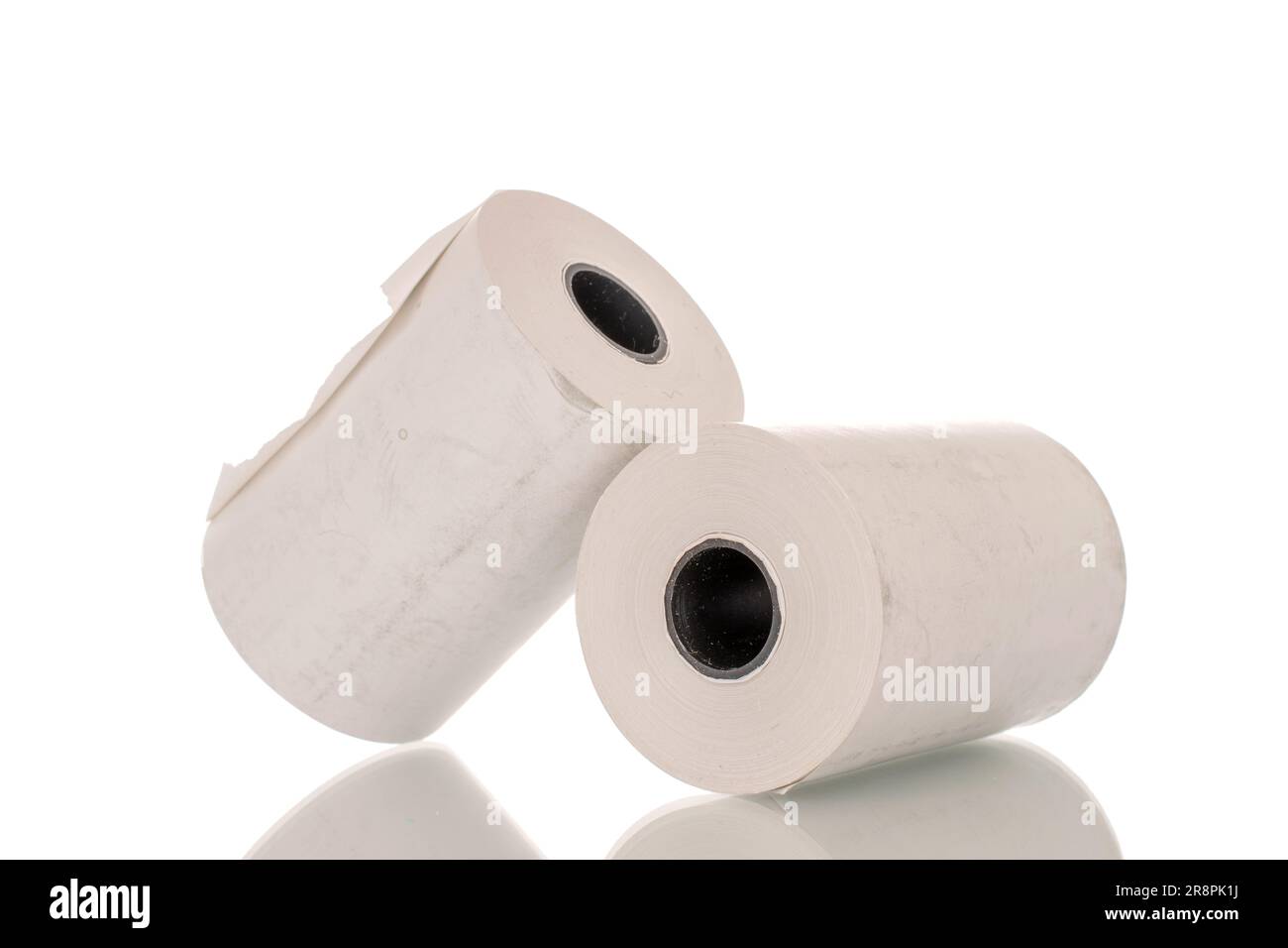 Two rolls of paper cash register tape, closeup isolated on white