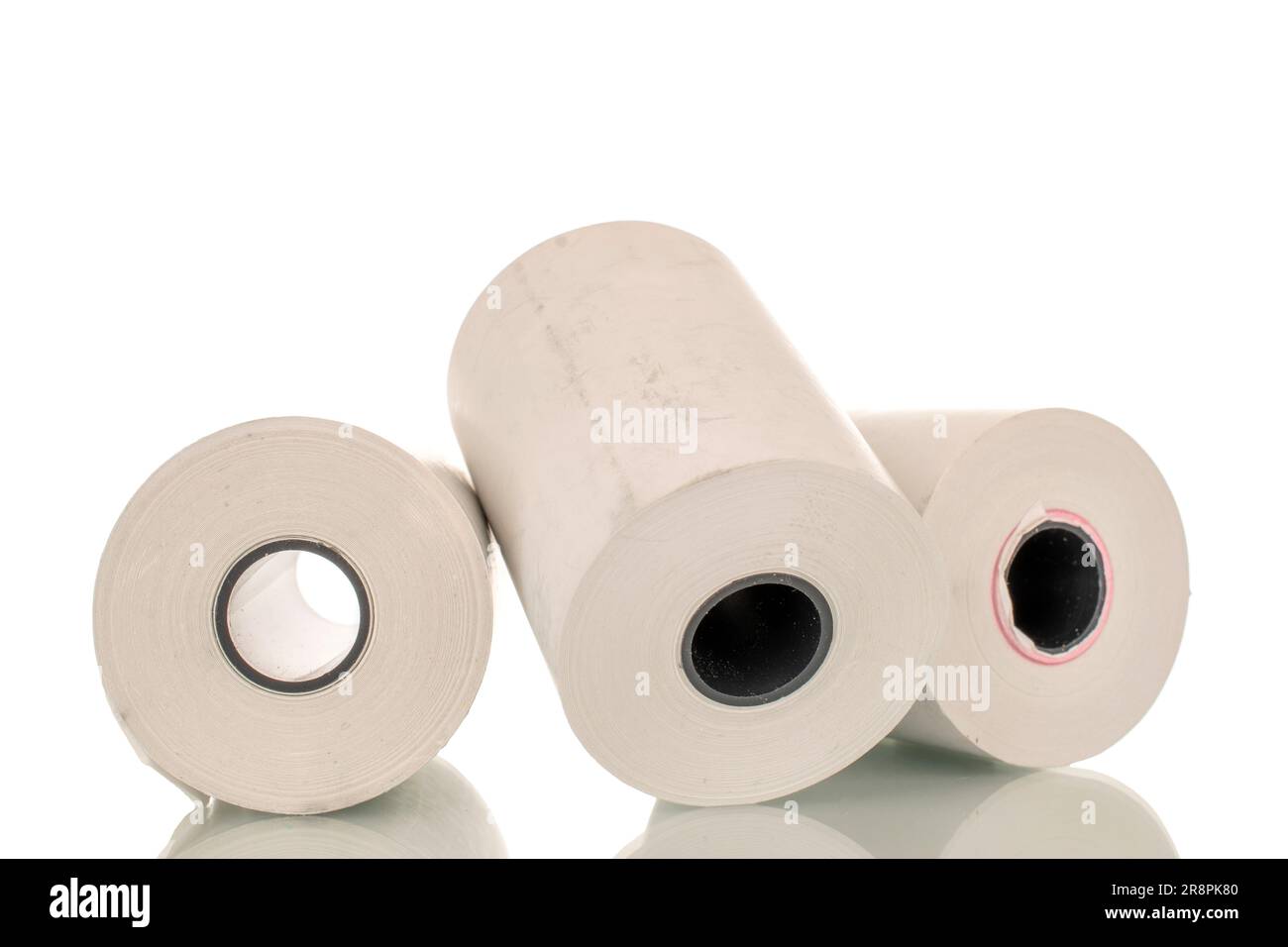 Three rolls of paper cash register tape, closeup isolated on white
