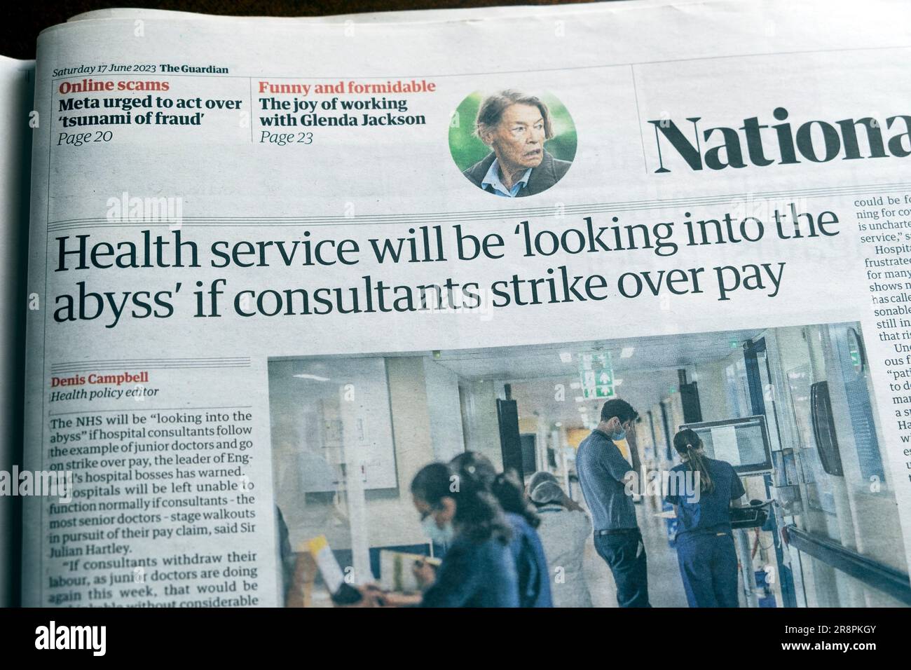 'Health service will be 'looking into the abyss' if consultants strike over pay' Guardian newspaper headline NHS consultants article 17 June 2023 UK Stock Photo