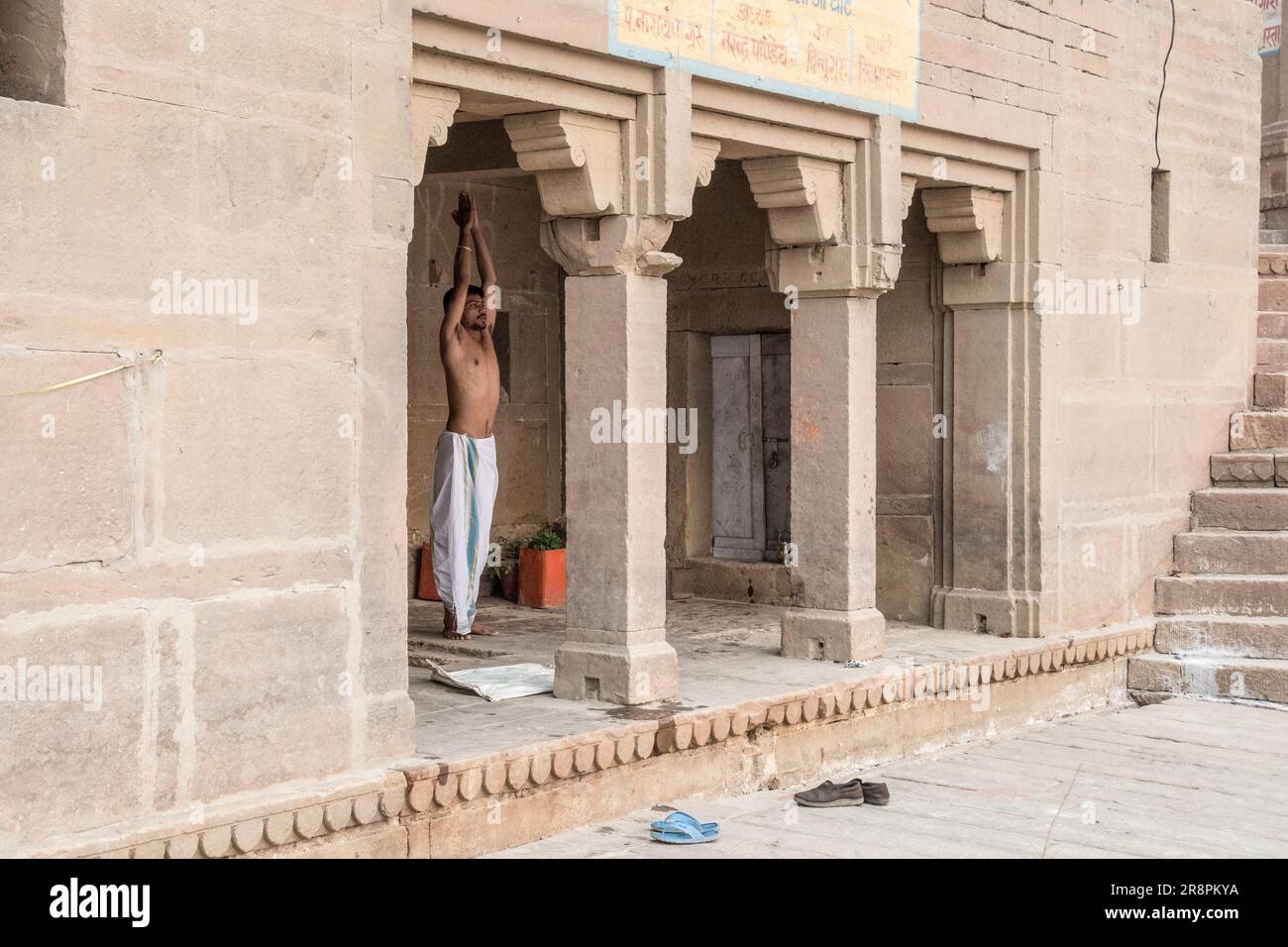 A man performs Yoga on the Ghats of Varanasi, India Stock Photo Alamy