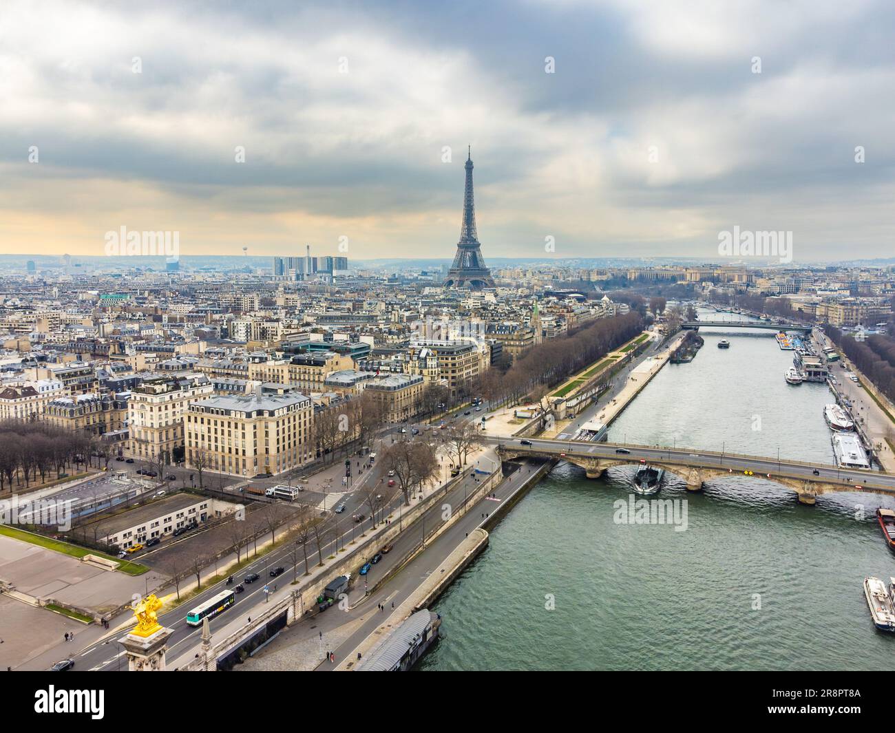 Aerial drone cityscape of Paris France, with the Eiffel Tower over the Seine River and the Pont Alexandre III Stock Photo