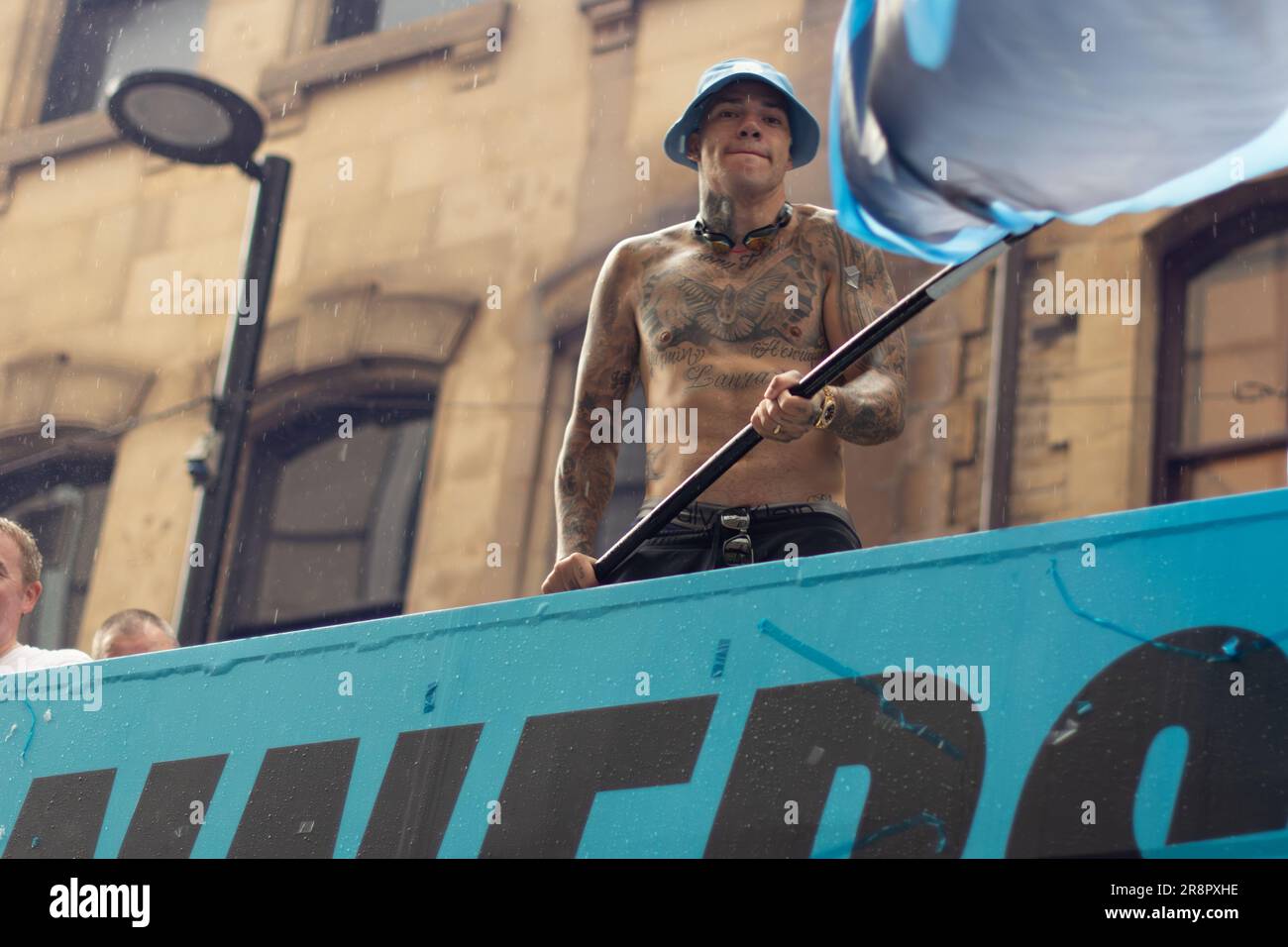 Ederson Santana de Moraes with chest tattoo. Manchester City football team open top bus parade during rain. Manchester UK Stock Photo