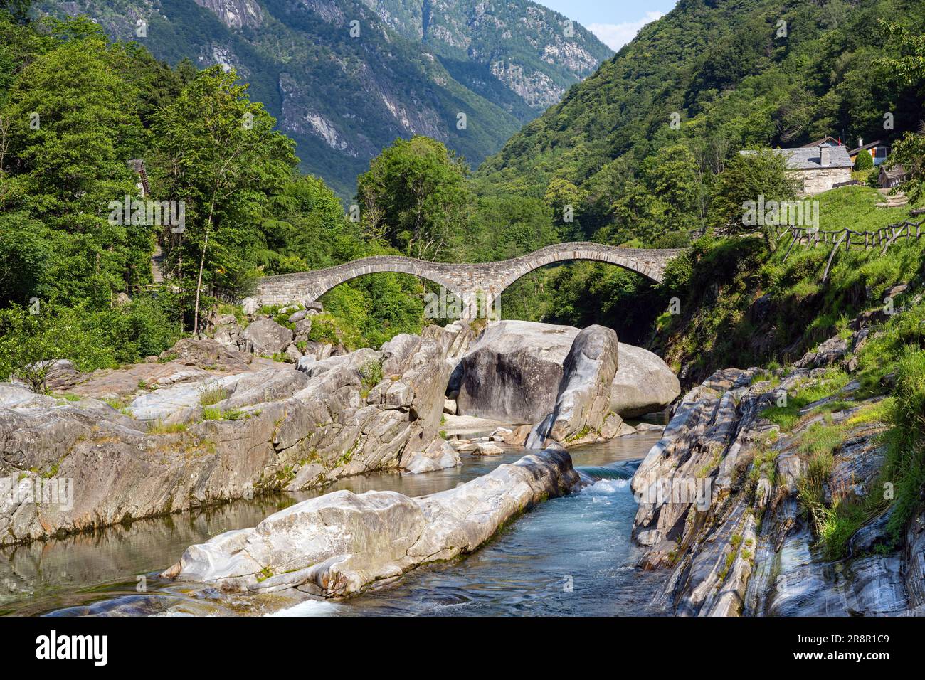 Roman bridge (Ponte dei Salti) crossing the Verzasca River at Lavertezzo in the Verzasca Valley, Canton of Ticino, Switzerland, Europe Stock Photo