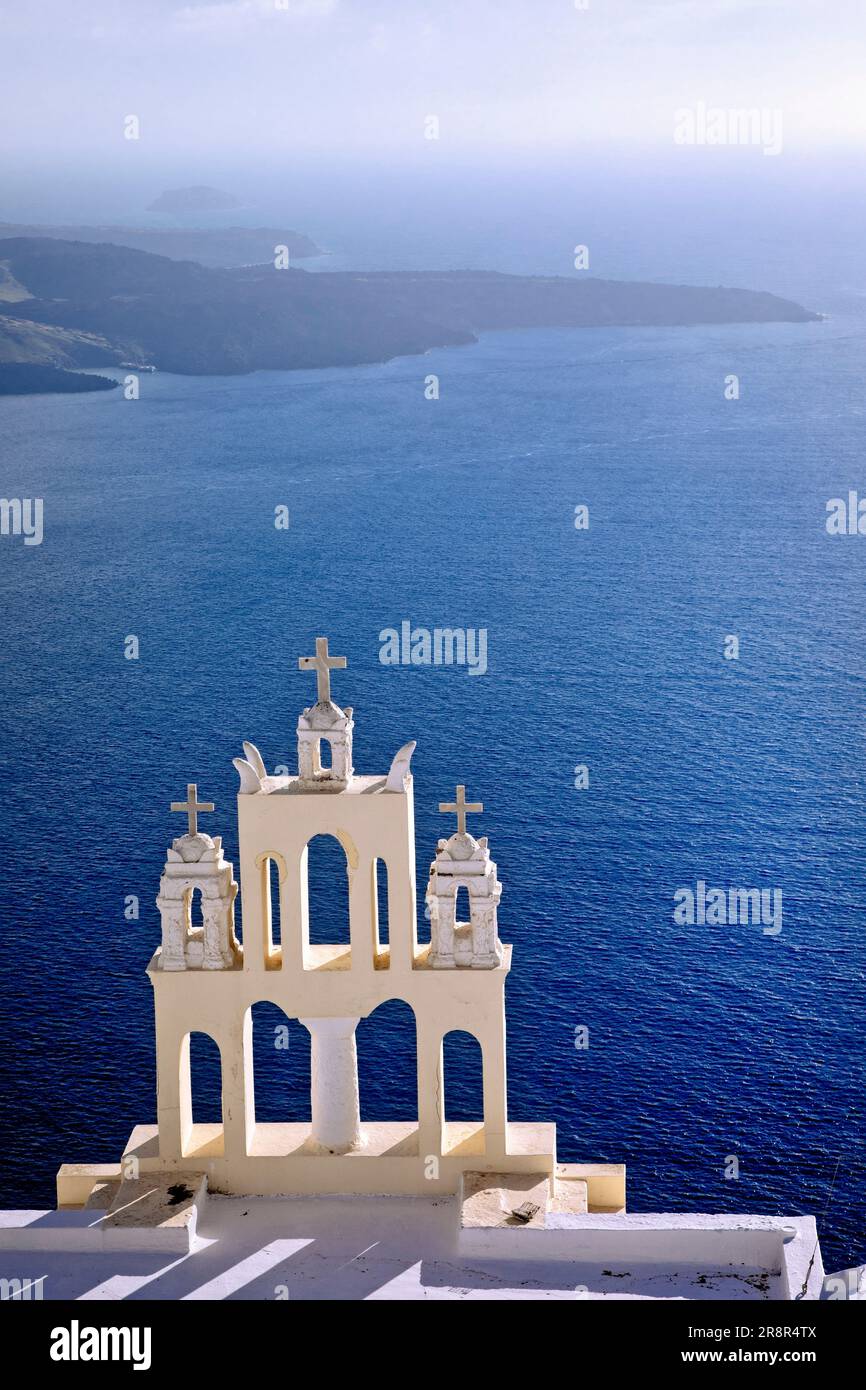 A church in Firostefani overlooks the caldera and Agean Sea in Santorini, Greece. Stock Photo