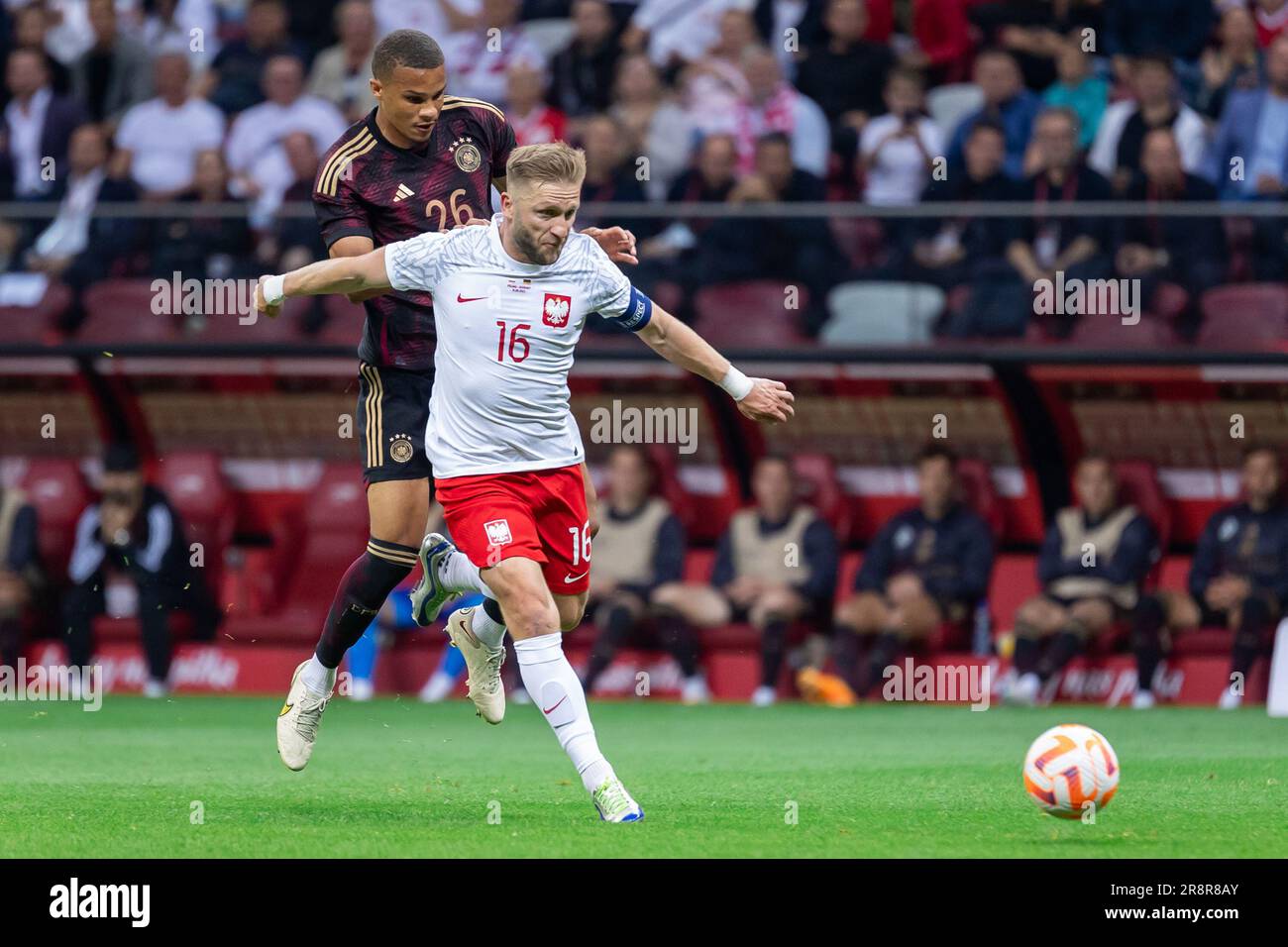 Malick Thiaw (L) of Germany and Jakub Blaszczykowski (R) of Poland in action during the friendly match between Poland and Germany at PGE Narodowy Stadium. (Final score; Poland 1:0 Germany) It was Jakub B?aszczykowski's last, 109th match for the Polish  football national team. Stock Photo