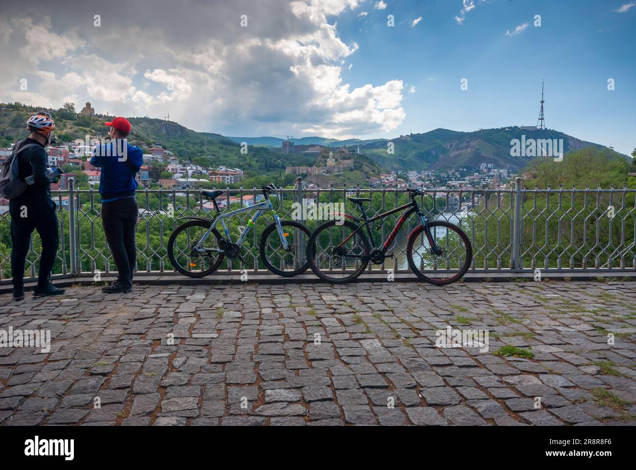 Georgia, Tbilisi - May 18, 2021: cyclers enjoying city view on a beautiful day. Stock Photo