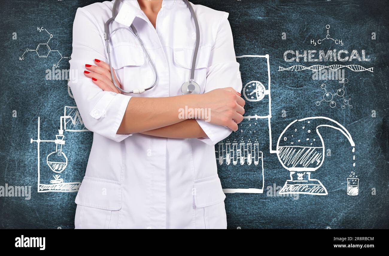 female doctor with stethoscope, scheme chemical reaction drawing on chalkboard Stock Photo