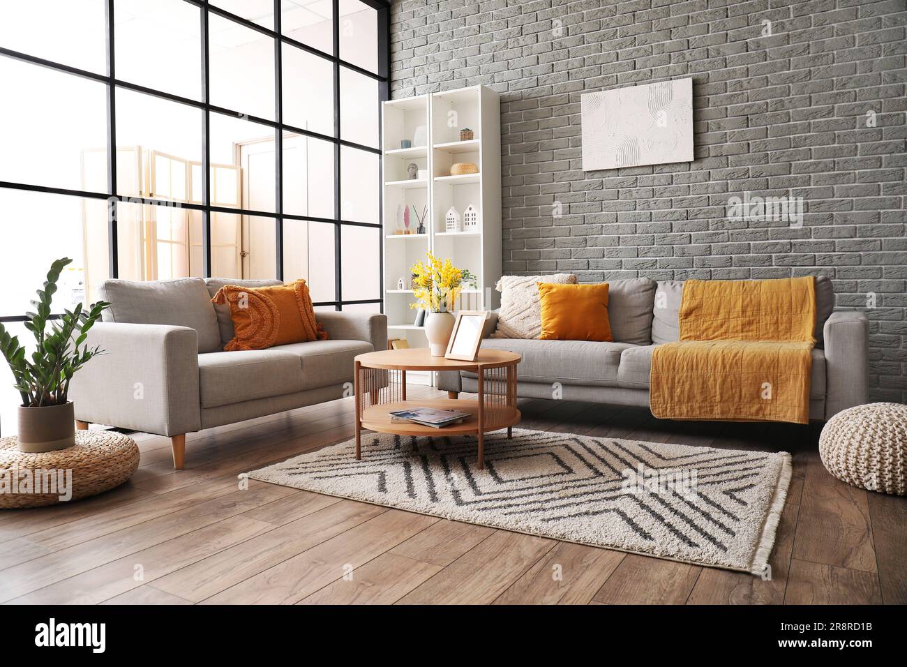 Interior of modern living room with sofas, coffee table and shelving ...