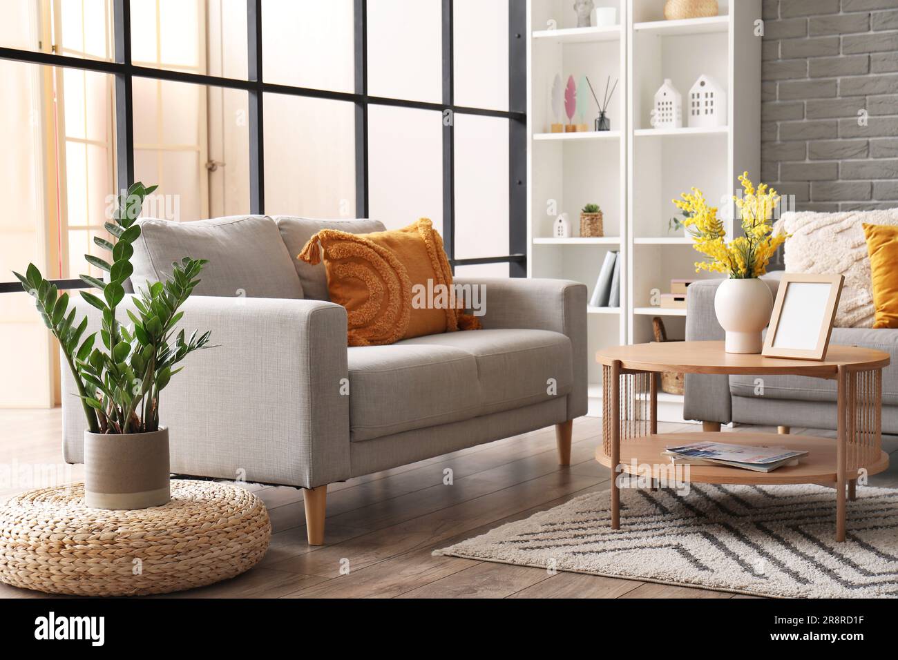 Interior of modern living room with sofas, coffee table and shelving ...
