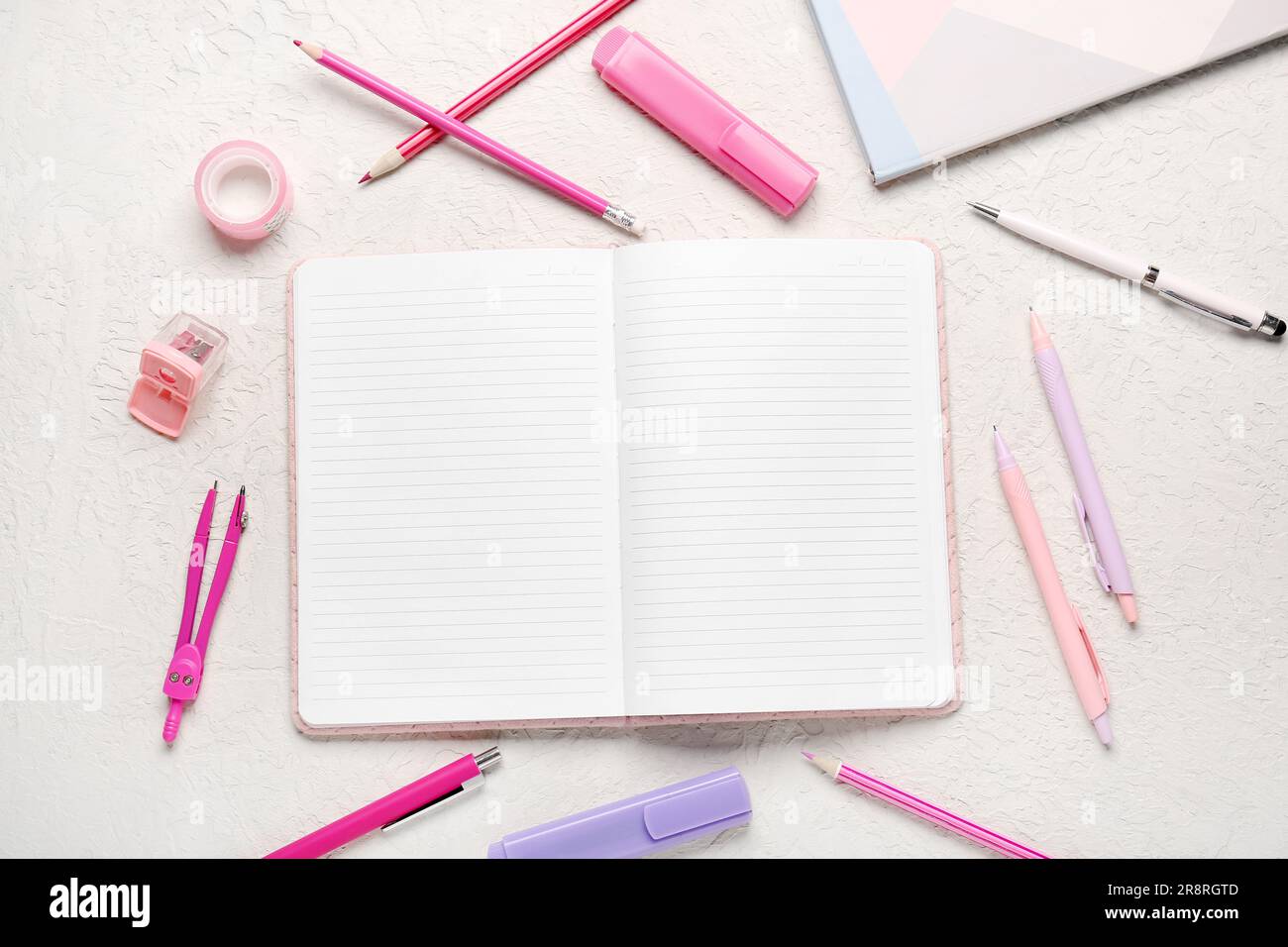 Notebooks with different stationery on grunge white background Stock Photo