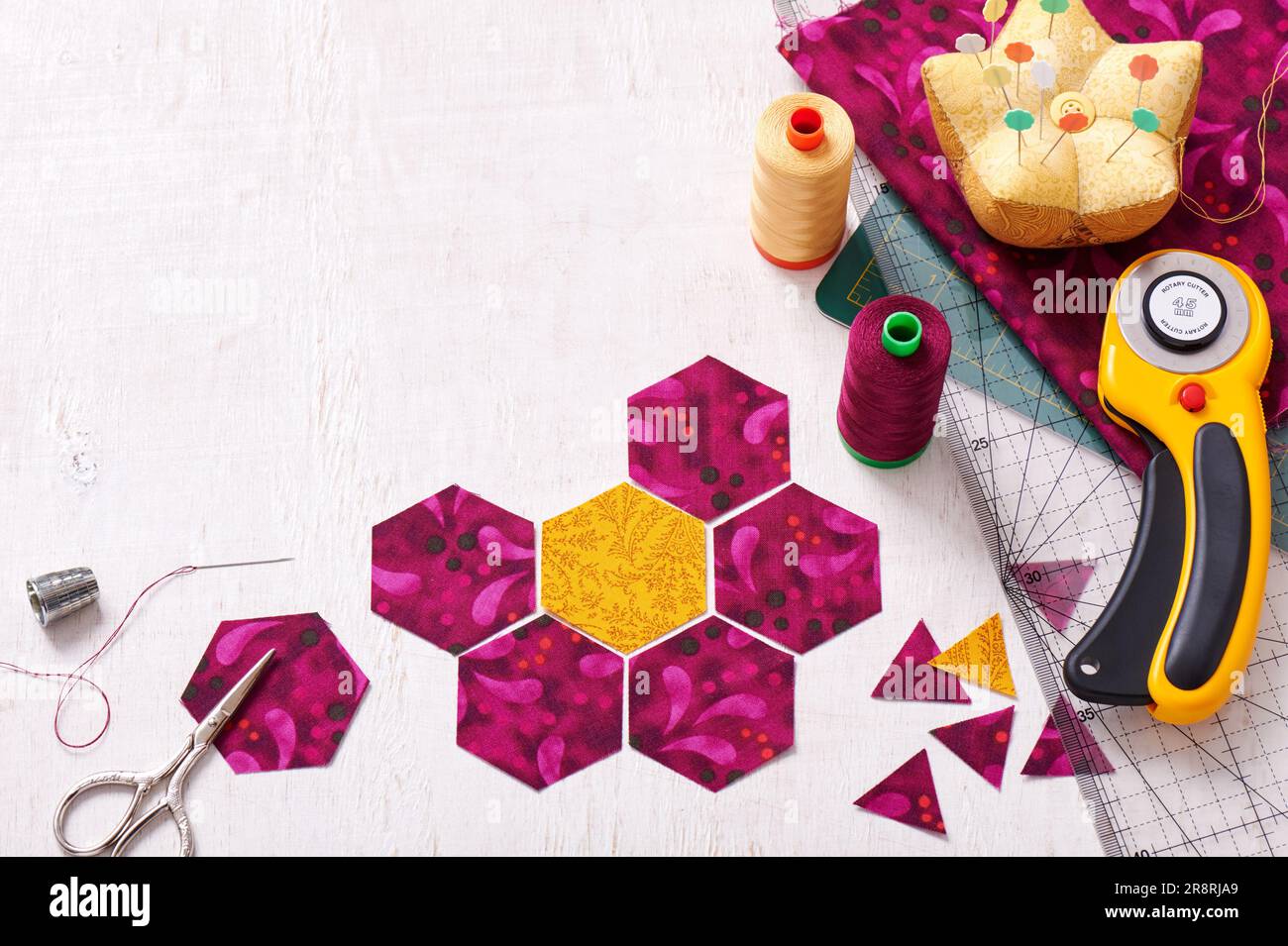 Preparation of hexagon pieces of fabric for sewing a quilt Grandmother