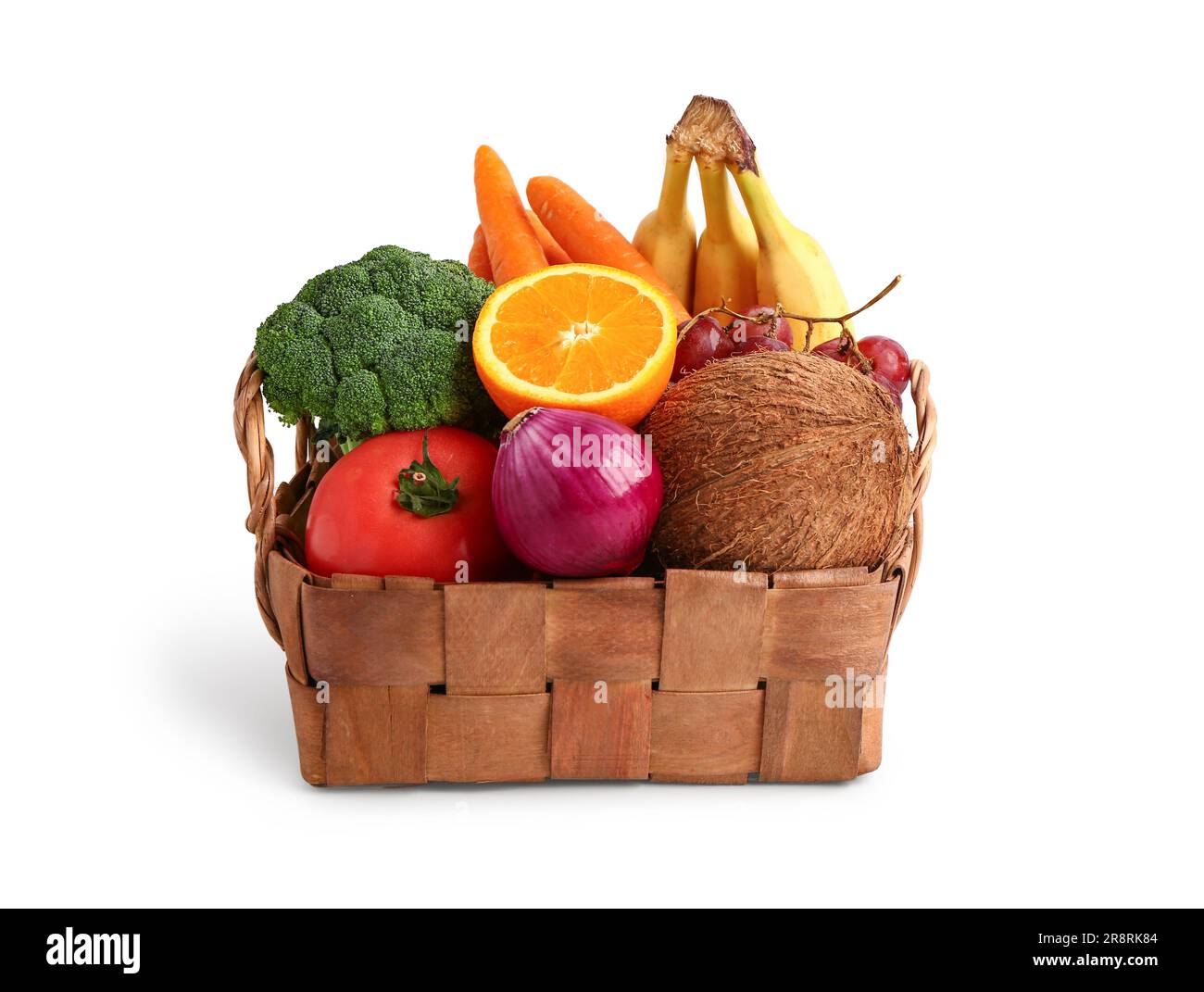 Wicker basket with different fresh fruits and vegetables on white ...