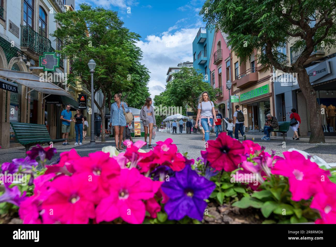 Espinho, Porto, Portugal - June 19, 2023: Wide view of a high street in the city of Espinho with tourists visiting the town on a sunny day Stock Photo