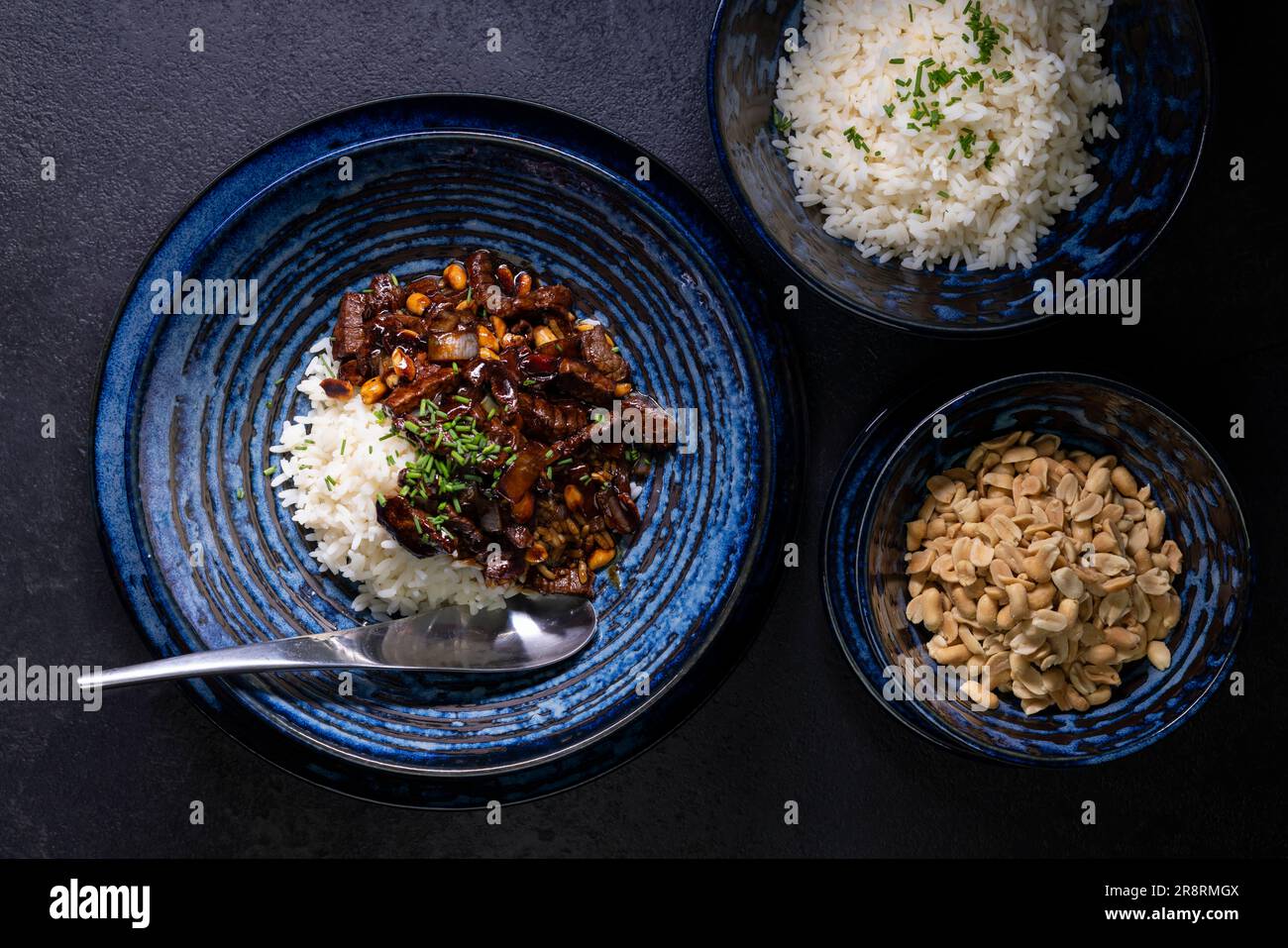 beef kung pao with peanuts and rice Stock Photo Alamy