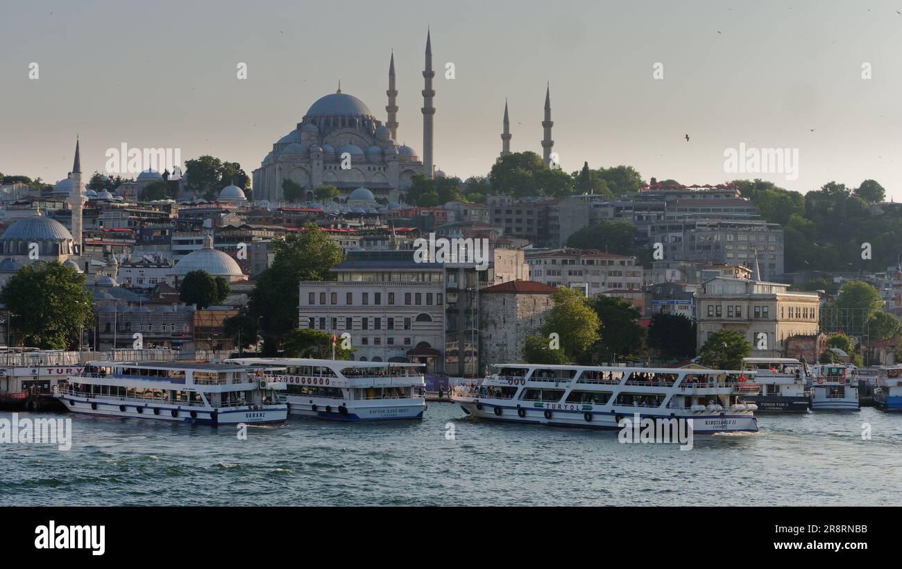 Passenger Ferries on the Golden Horn River at Eminonu and the Suleymaniye Mosque, Istanbul, Turkey Stock Photo