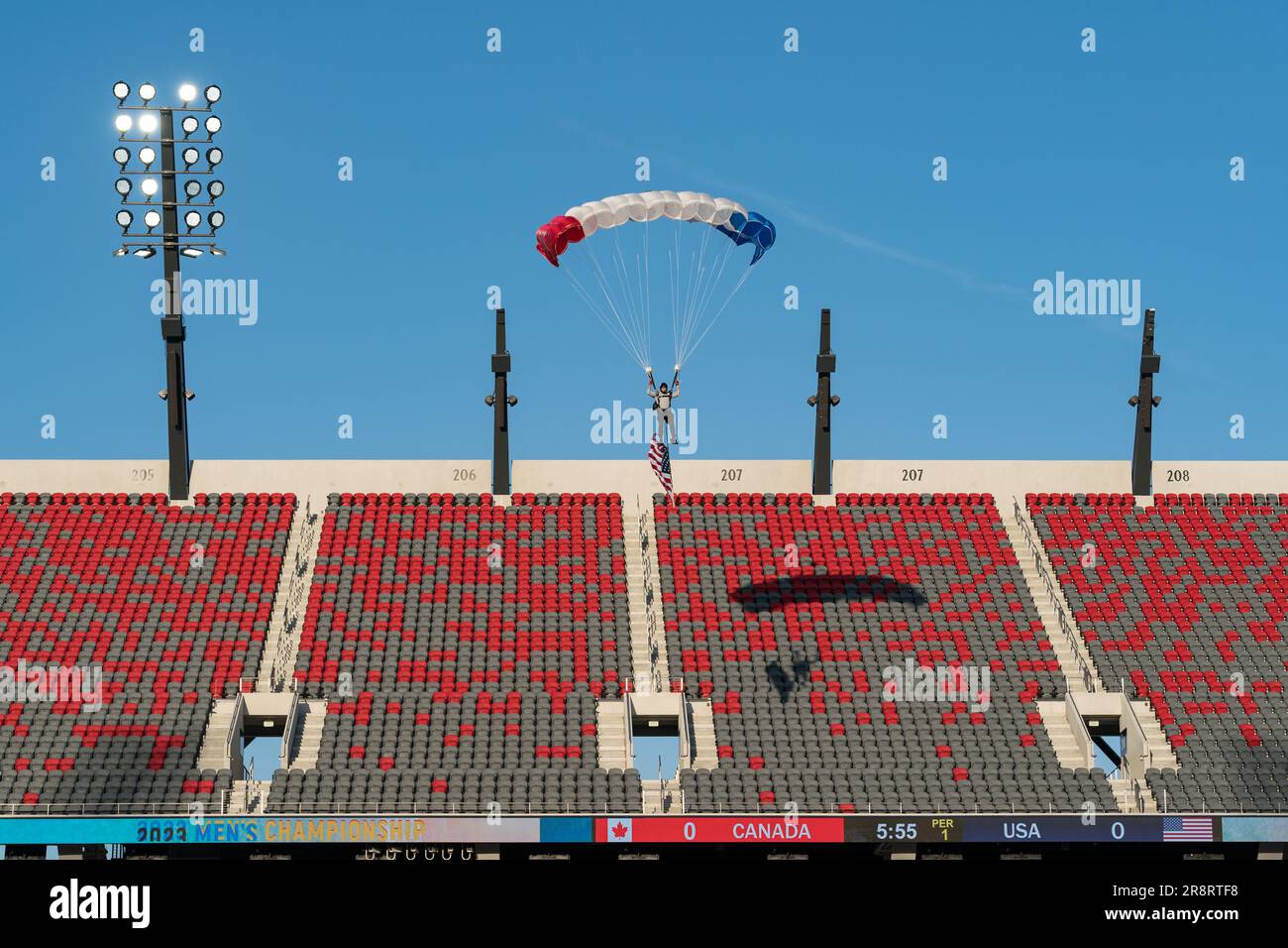 San Diego, USA. 21st June, 2023. A parachuter arrives on the field before the start of the World Lacrosse Men's Championship opening game USA vs Canada at Snapdragon Stadium. Credit: Ben Nichols/Alamy Live News Stock Photo