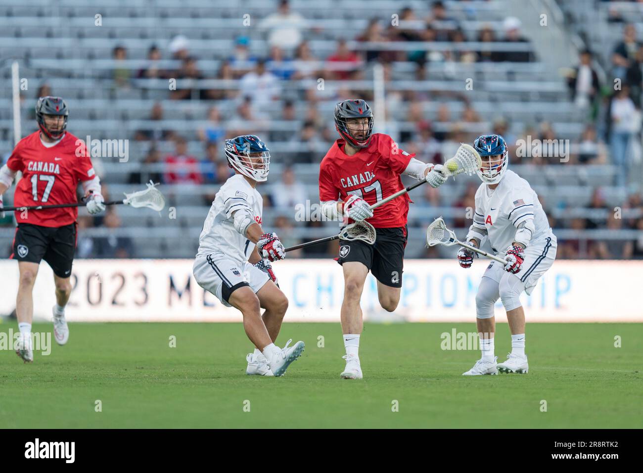 San Diego, USA. 21st June, 2023. Zach Currier (77) breaks through the USA defense at the World Lacrosse Men's Championship opening game USA vs Canada at Snapdragon Stadium. Credit: Ben Nichols/Alamy Live News Stock Photo
