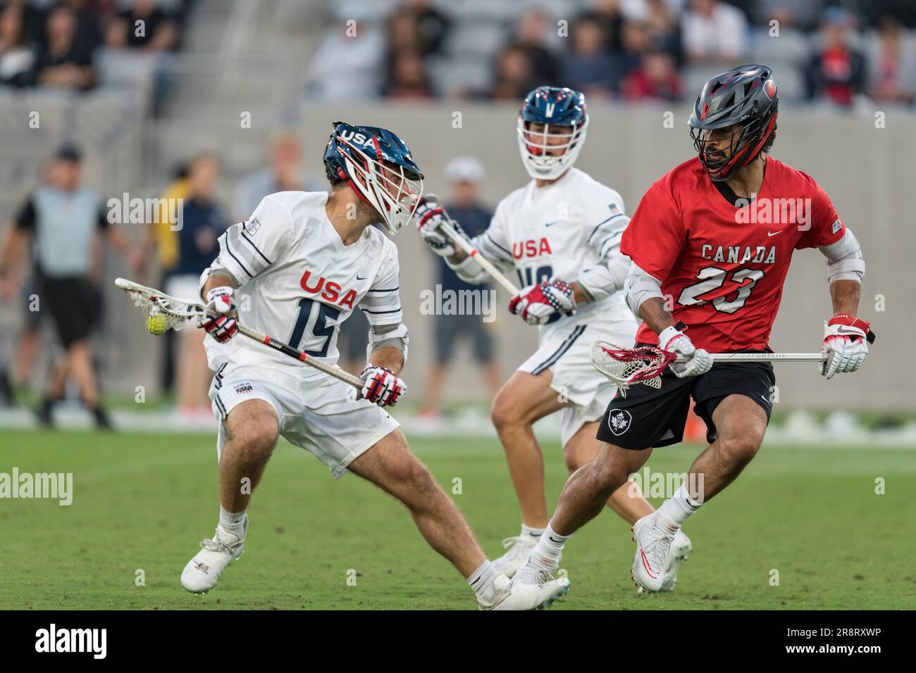 San Diego, USA. 21st June, 2023. Ryan Conrad (15) of USA against Challen Rogers (23) of Canada at the World Lacrosse Men's Championship opening game USA vs Canada at Snapdragon Stadium. Credit: Ben Nichols/Alamy Live News Stock Photo