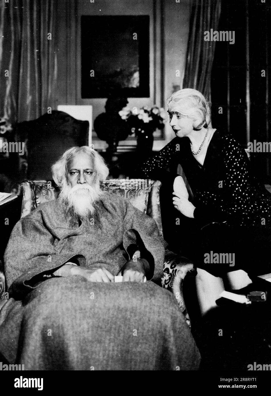 When East Meets West -- Rabindranath Tagore, famed Hindu Philosopher and Poet, with Ruth St. Denis, renowned interpreter of oriental dances. The pair will appear in a joint recital of poems and dances Sunday, December 14th, for the benefit of the International University which is to be Tagore's monument. October 12, 1930. (Photo by International Newsreel Photo). Stock Photo