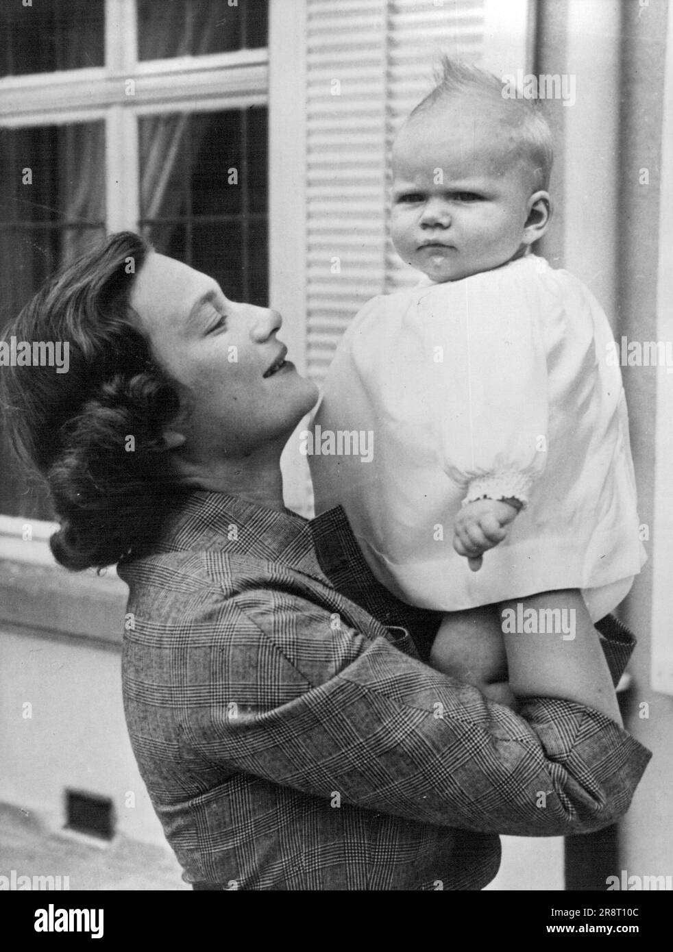 Princess Josephine-Charlotte and Princess Marie-Astrid Of Luxemburg Princess Josephine-Charlotte, daughters of ex-King Leopold of Belgium, holds aloft her six-months-old daughter, Marie-Astrid. - Princess Josephine-Charlotte is the wife of Prince Jean. Hereditary Grand Duke and Heir Apparent to the Throne of Luxemburg; they ware married in April, 1953. August 11, 1953. (Photo by Camera Press). Stock Photo